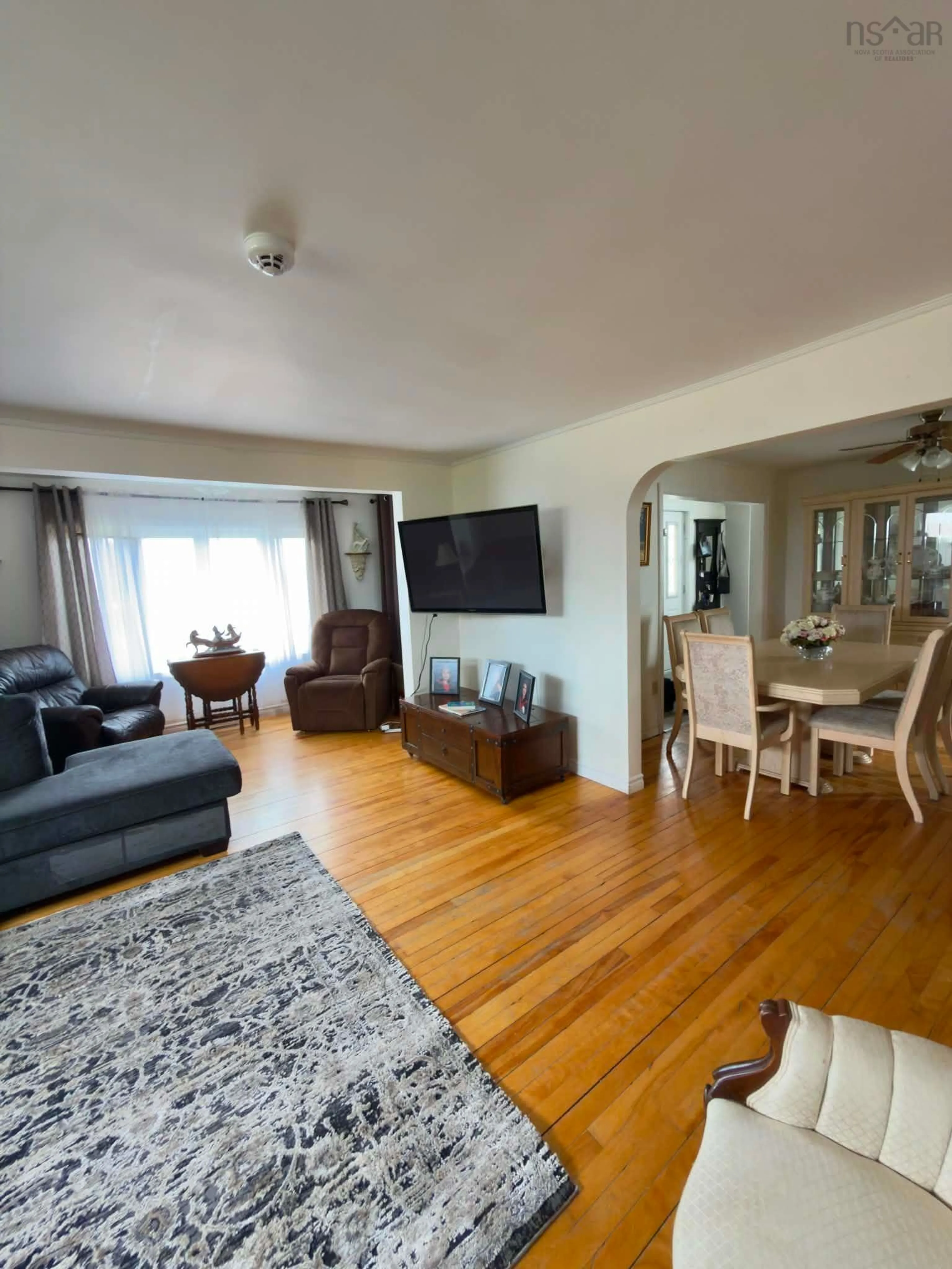 Living room with furniture, wood/laminate floor for 143 Lake Rd, Glace Bay Nova Scotia B1A 2G8