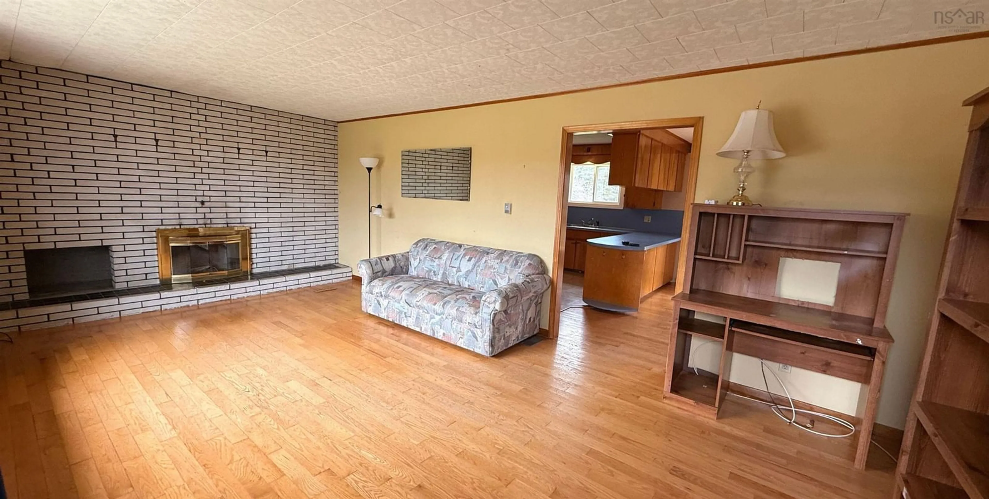 Living room with furniture, wood/laminate floor for 2288 Highway 1, Wellington Nova Scotia B5A 5A8