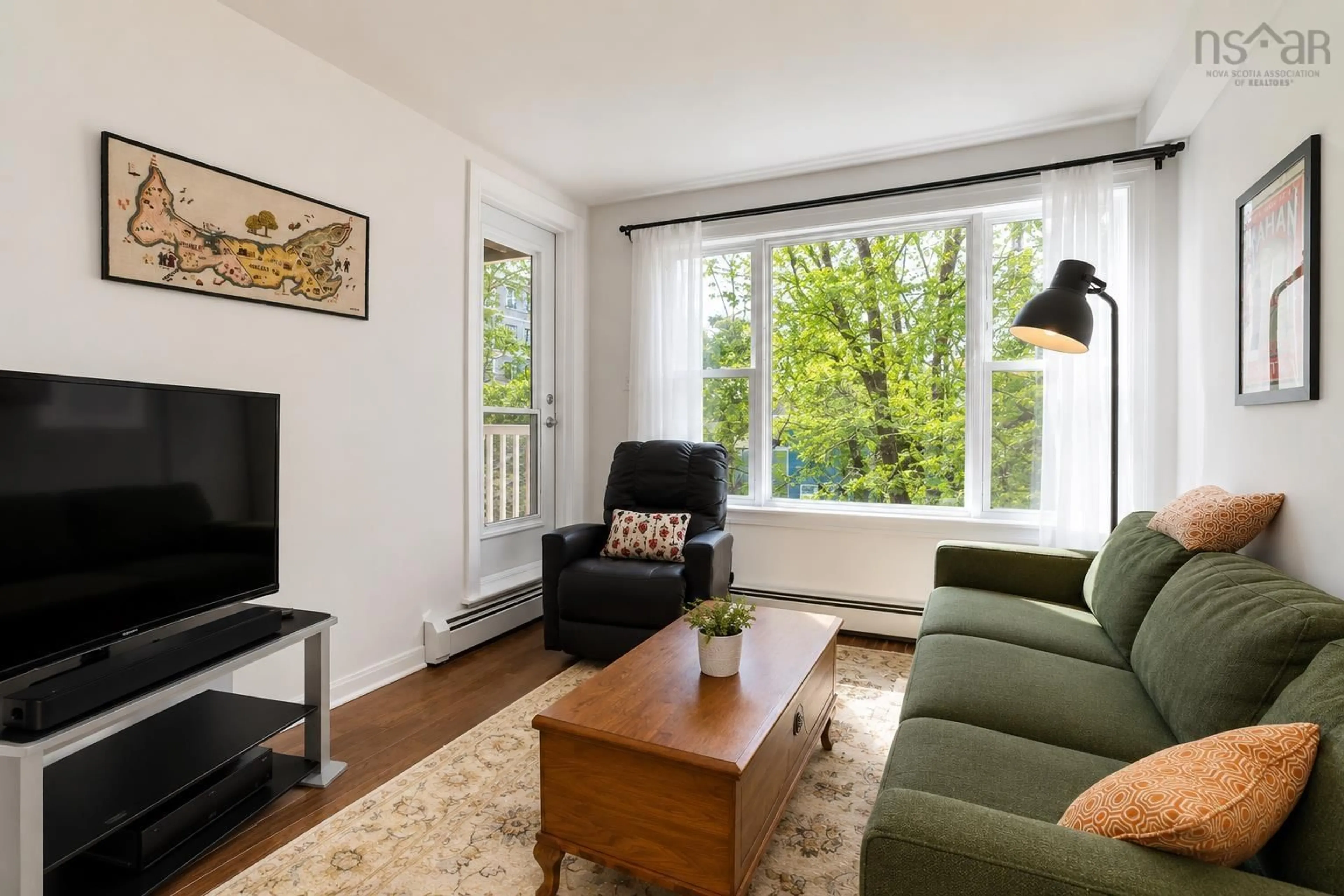 Living room with furniture, wood/laminate floor for 5230 Tobin St #207, Halifax Nova Scotia B3H 1S2