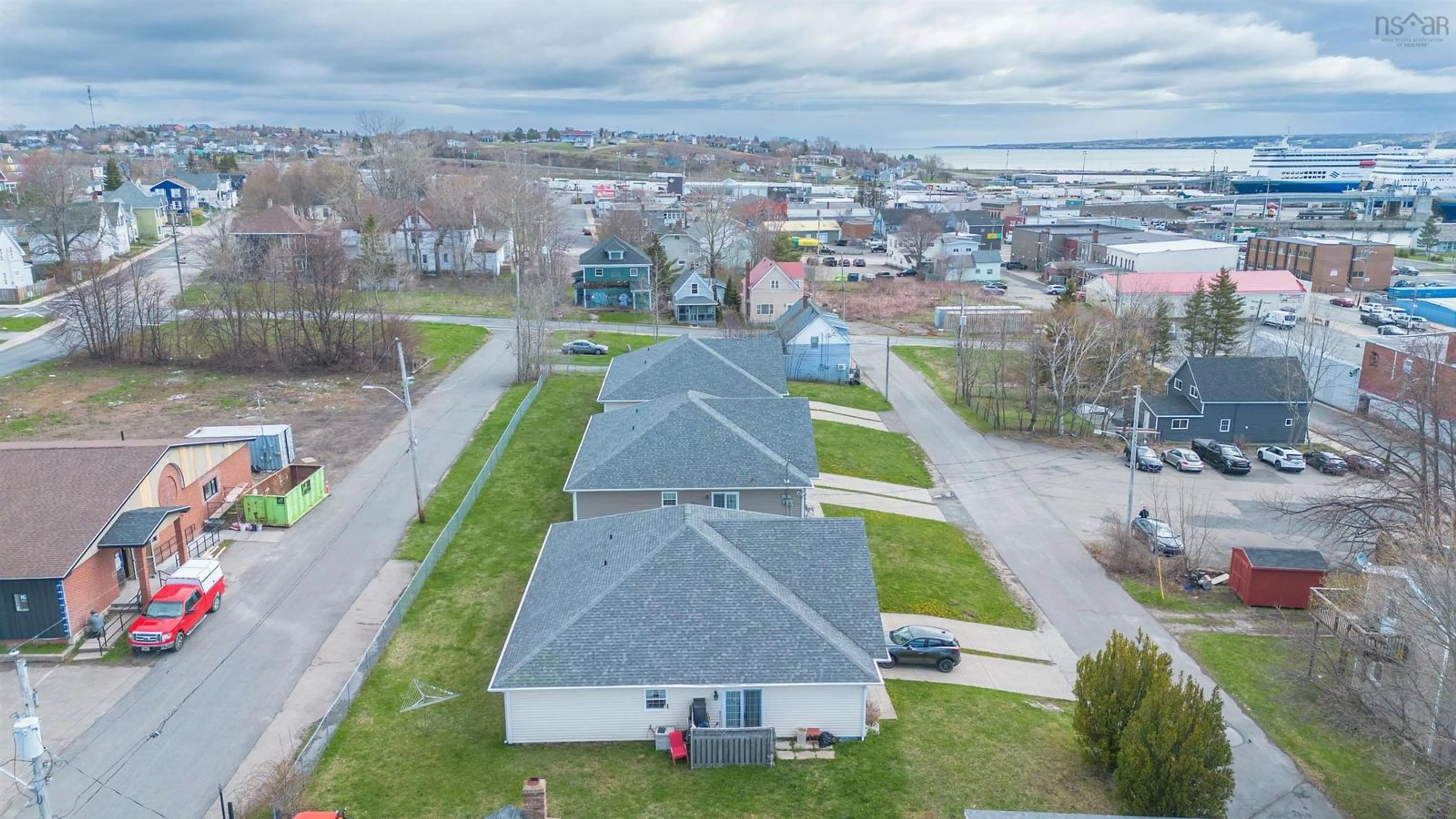 A pic from outside/outdoor area/front of a property/back of a property/a pic from drone, water/lake/river/ocean view for 28 George St, North Sydney Nova Scotia B2A 1J3