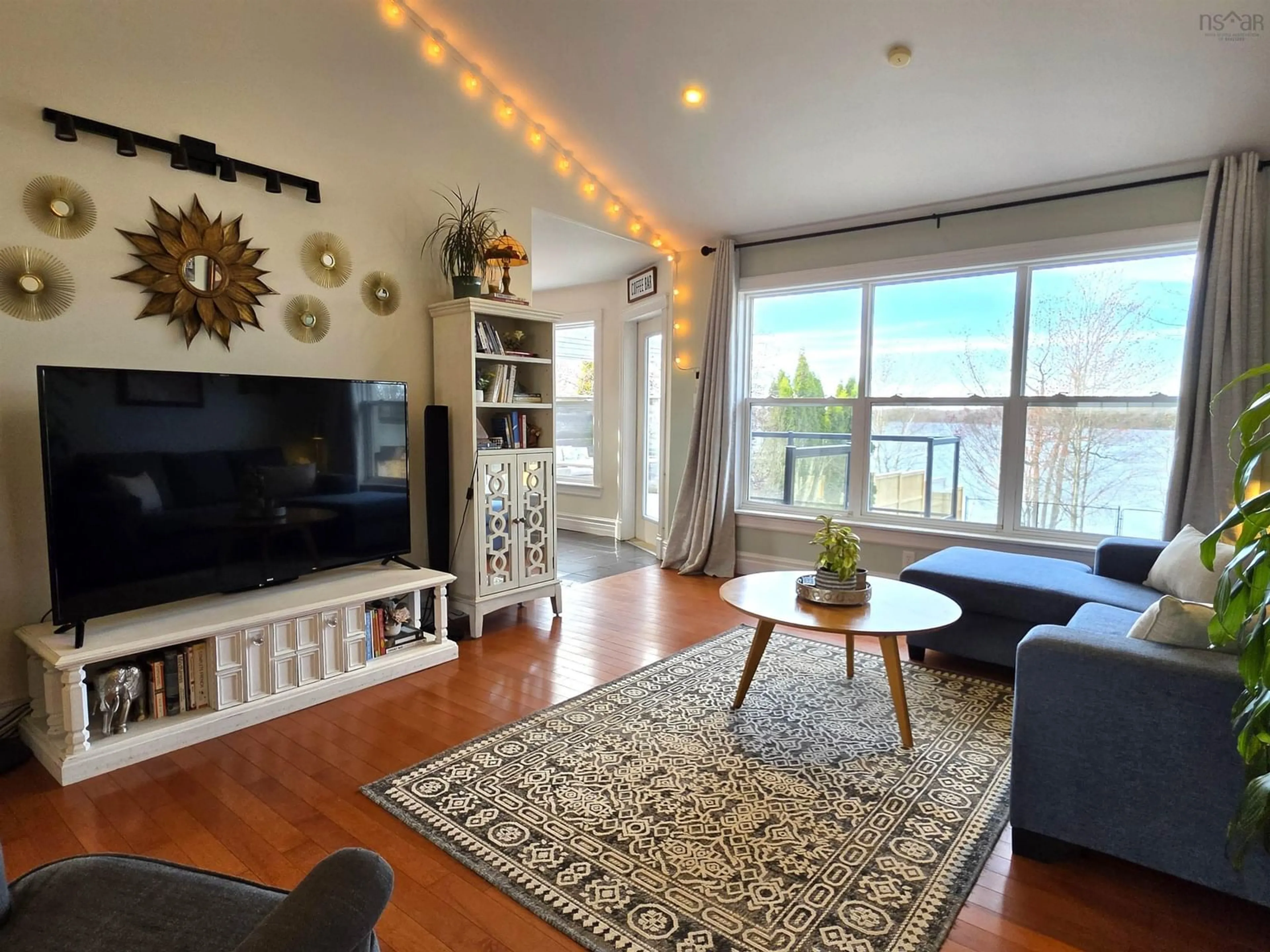 Living room with furniture, wood/laminate floor for 34 Lakeridge Cres, Colby South Nova Scotia B2V 2V2