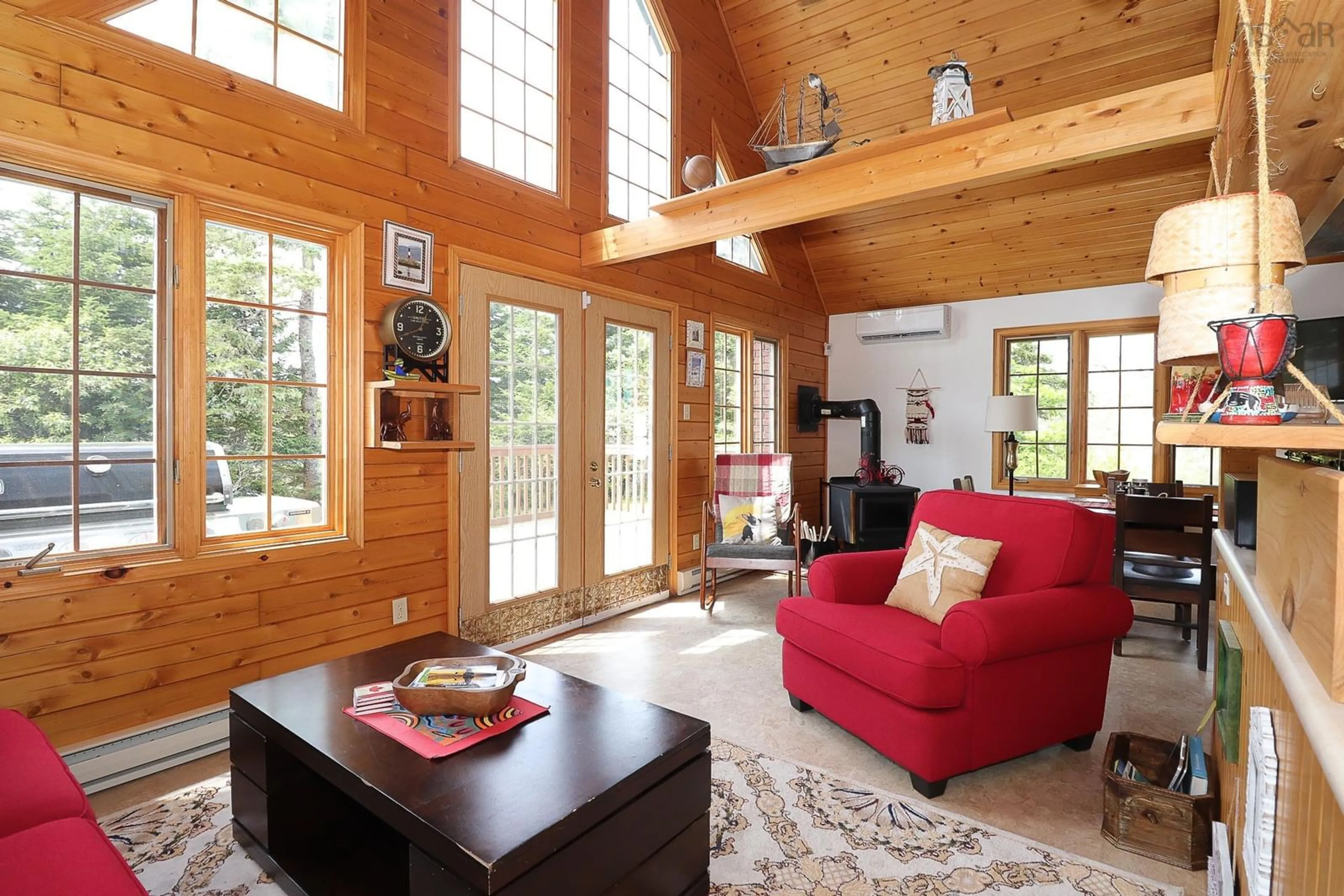 Living room with furniture, wood/laminate floor for 148 Stevens Rd, East Green Harbour Nova Scotia B0T 1L0