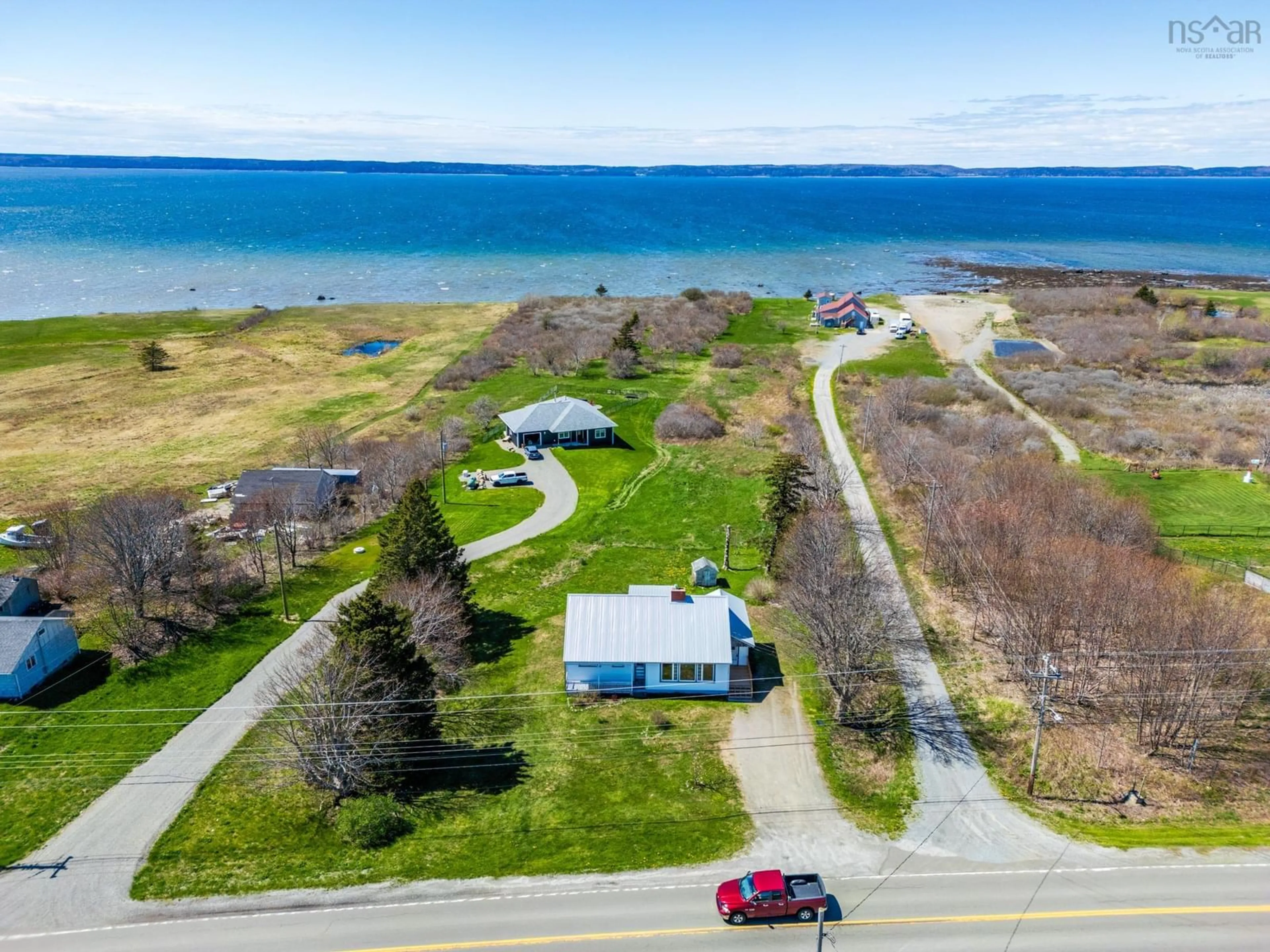 A pic from outside/outdoor area/front of a property/back of a property/a pic from drone, water/lake/river/ocean view for 3367 Highway 1, Belliveaus Cove Nova Scotia B0W 3T0