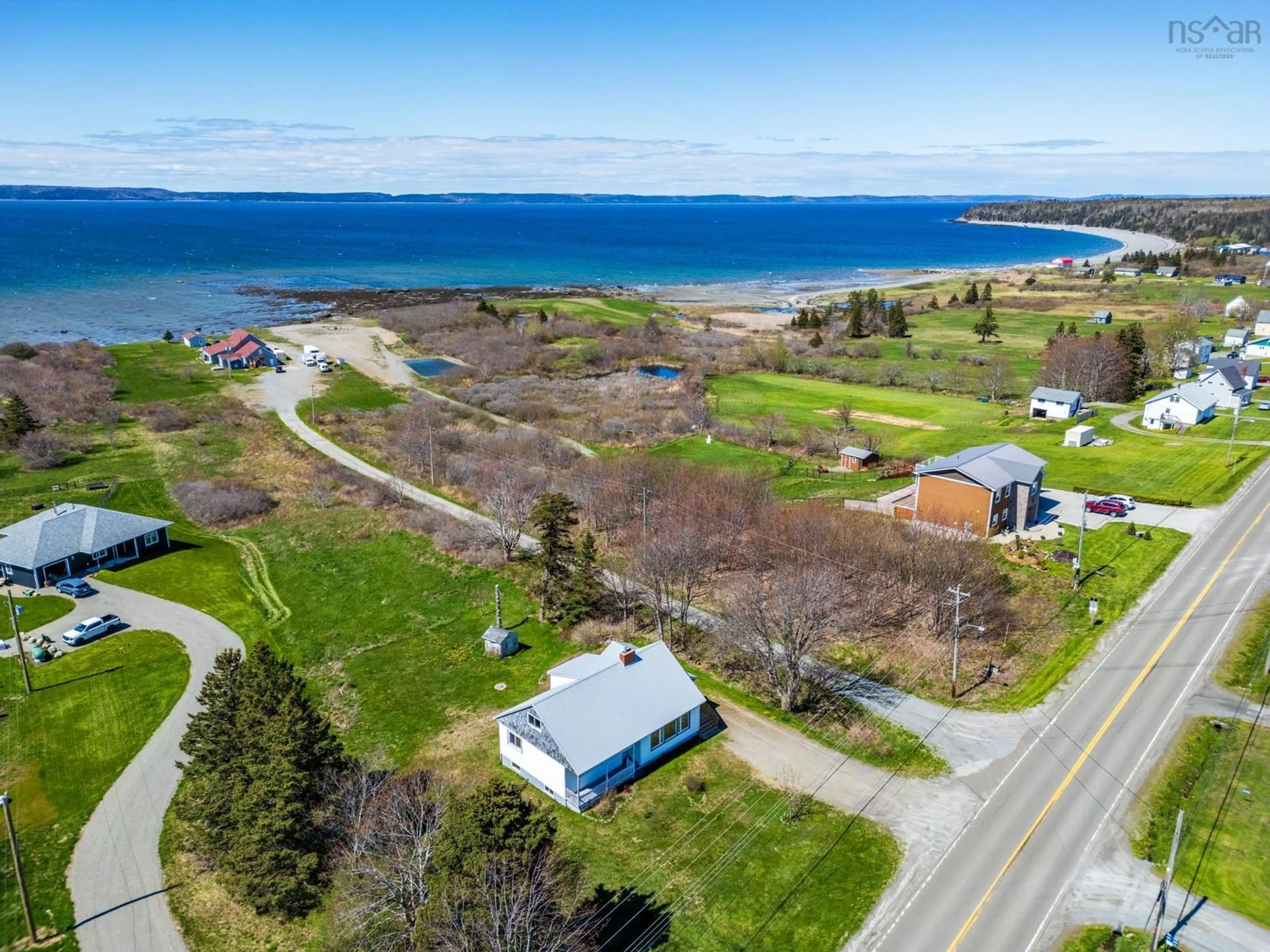 A pic from outside/outdoor area/front of a property/back of a property/a pic from drone, water/lake/river/ocean view for 3367 Highway 1, Belliveaus Cove Nova Scotia B0W 3T0