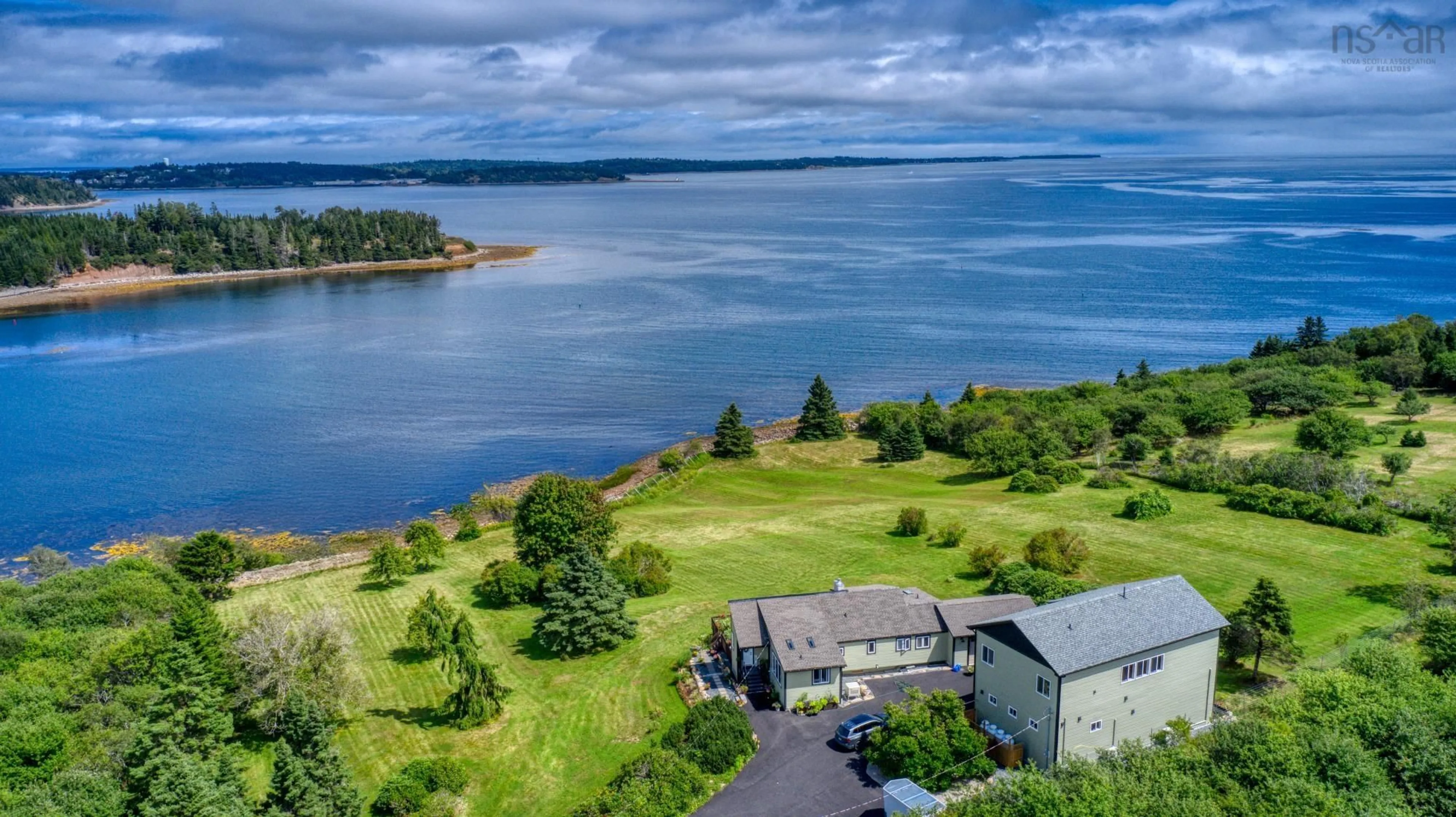 A pic from outside/outdoor area/front of a property/back of a property/a pic from drone, water/lake/river/ocean view for 177 Corkums Island Rd, Corkums Island Nova Scotia B0J 2C0