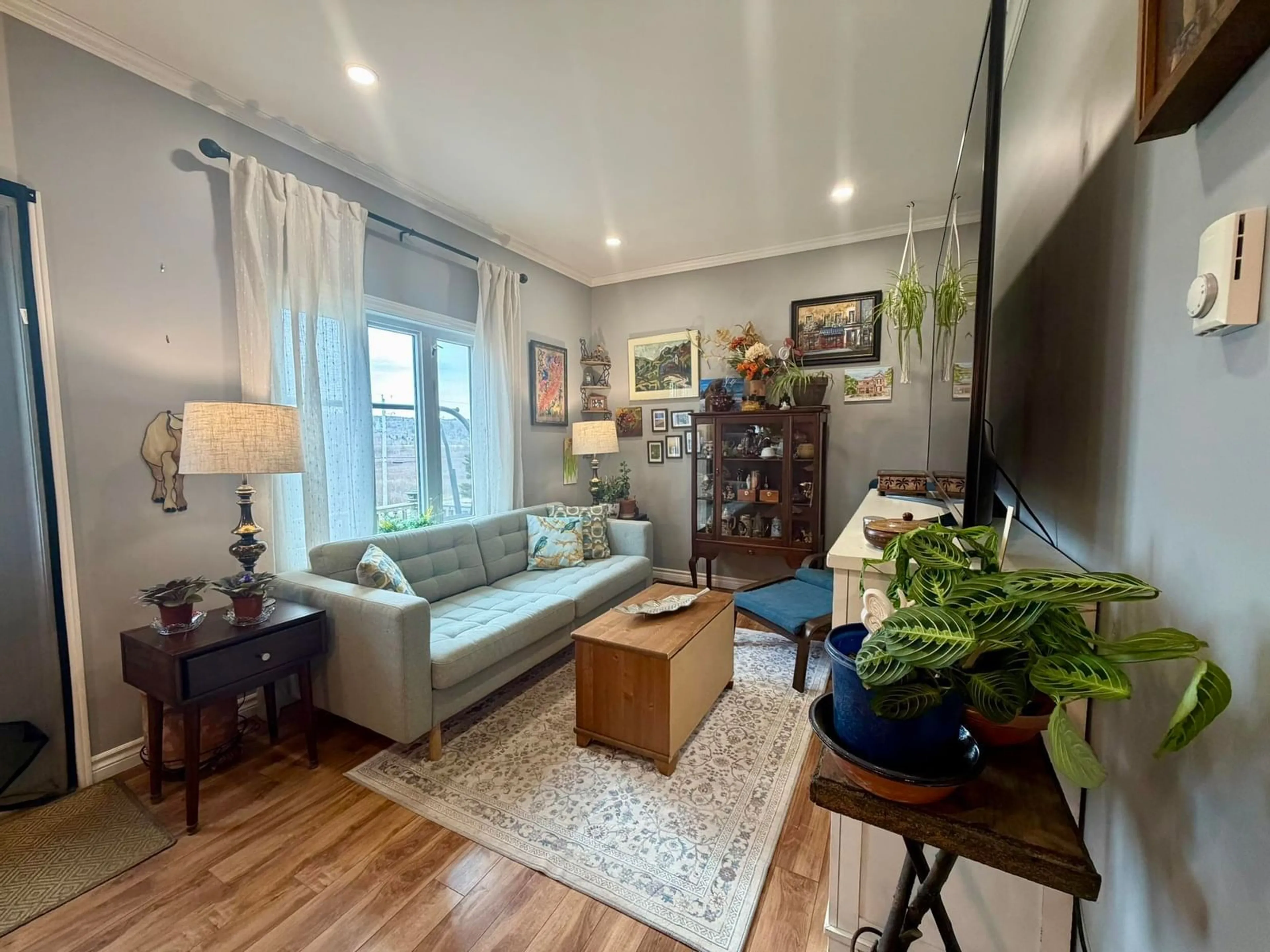 Living room with furniture, wood/laminate floor for 9384 Highway 7, Stillwater Nova Scotia B0H 1E0