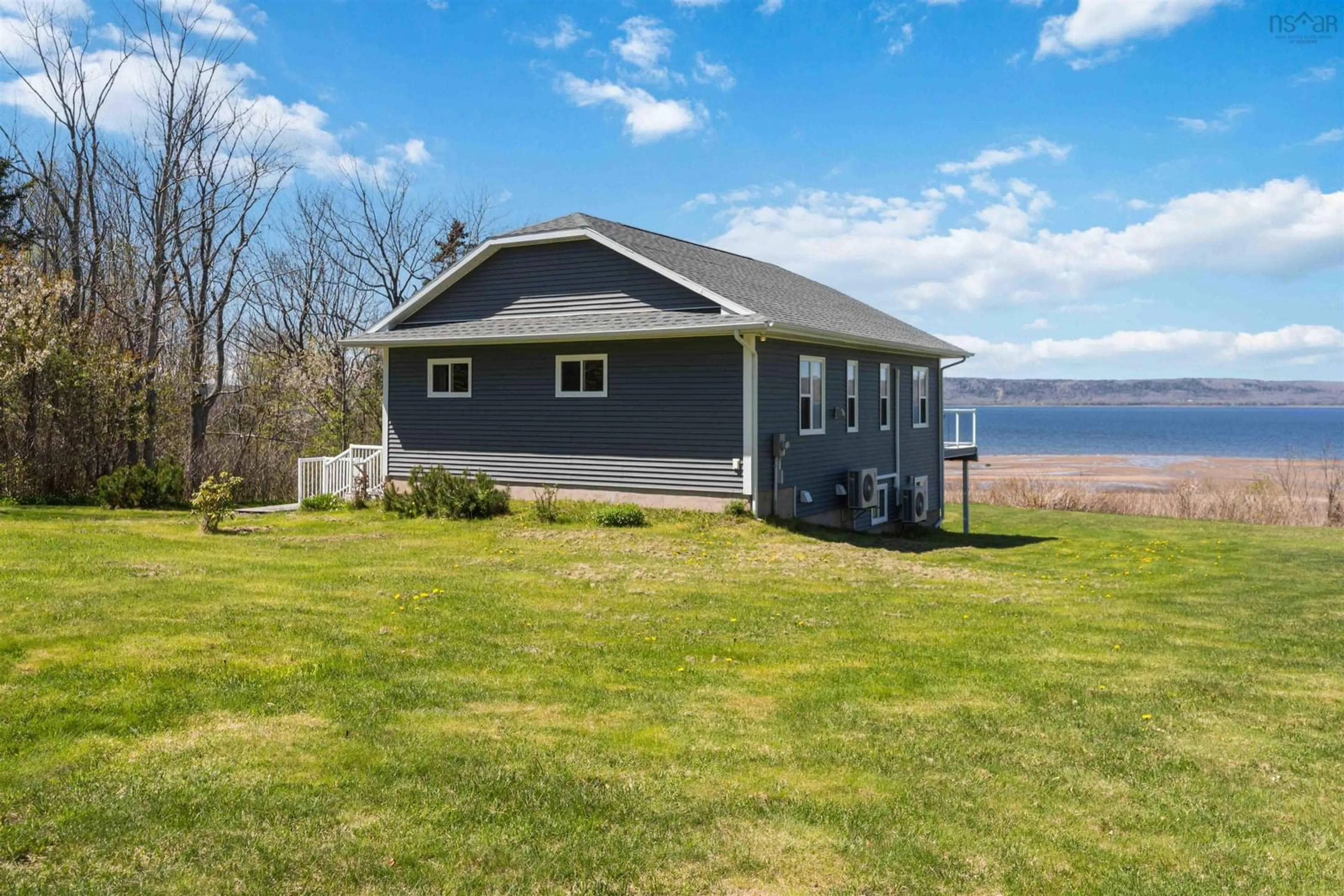 A pic from outside/outdoor area/front of a property/back of a property/a pic from drone, water/lake/river/ocean view for 38 Shore Dr, Deep Brook Nova Scotia B0S 1J0