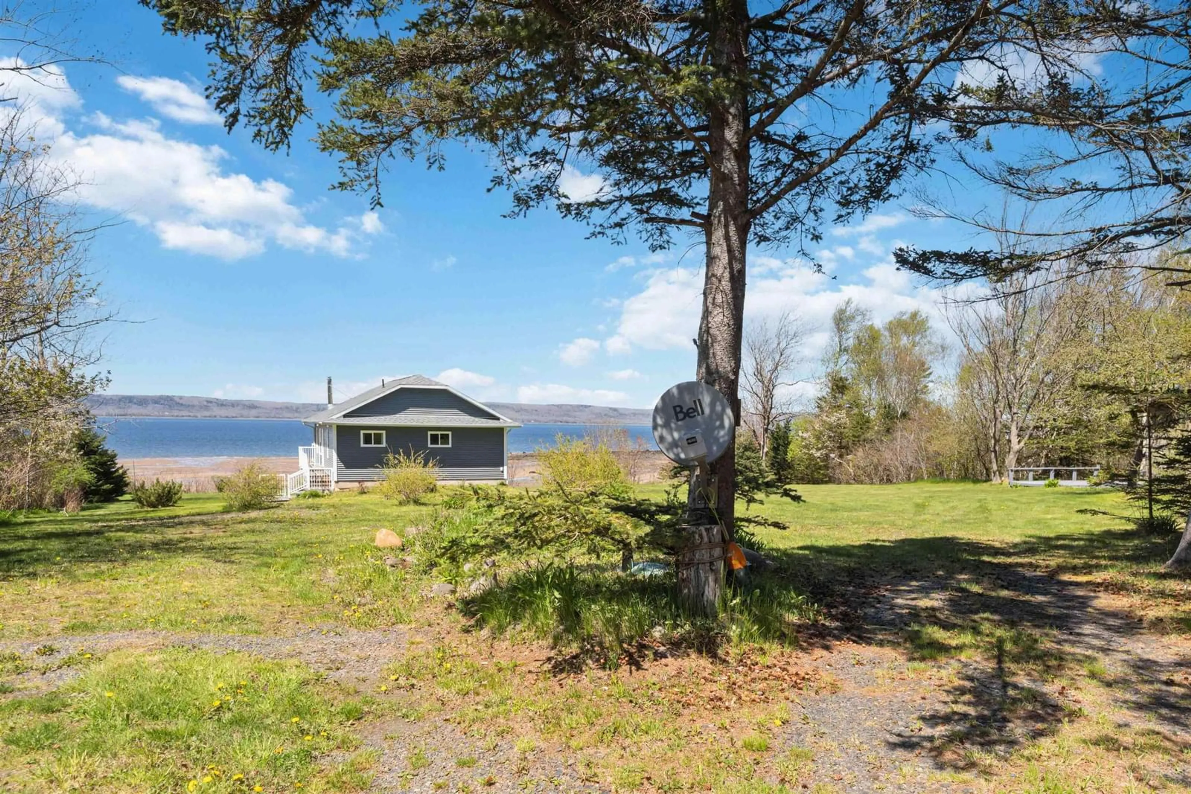 A pic from outside/outdoor area/front of a property/back of a property/a pic from drone, water/lake/river/ocean view for 38 Shore Dr, Deep Brook Nova Scotia B0S 1J0