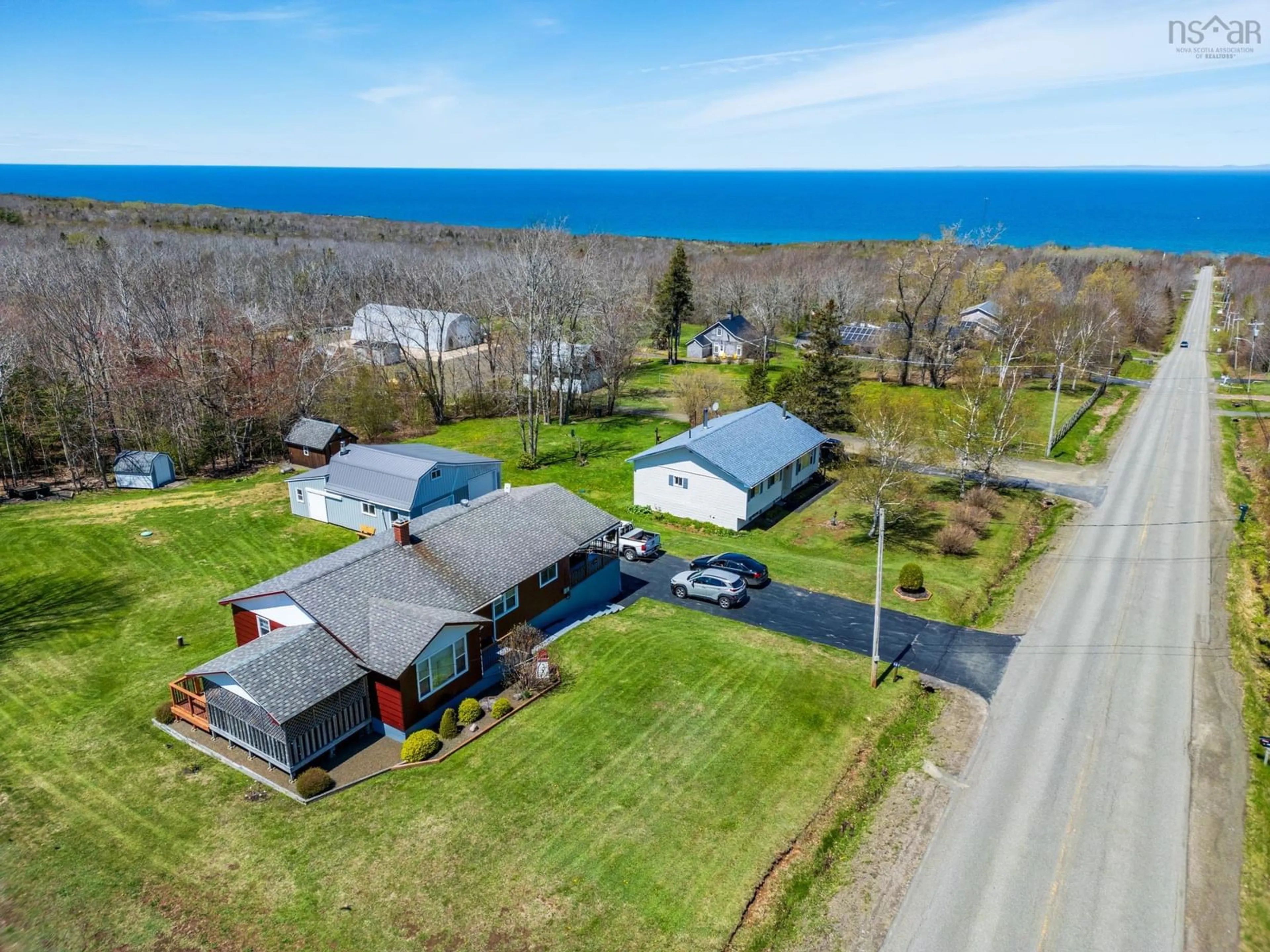 A pic from outside/outdoor area/front of a property/back of a property/a pic from drone, water/lake/river/ocean view for 987 Parker Mountain Rd, Parkers Cove Nova Scotia B0S 1A0