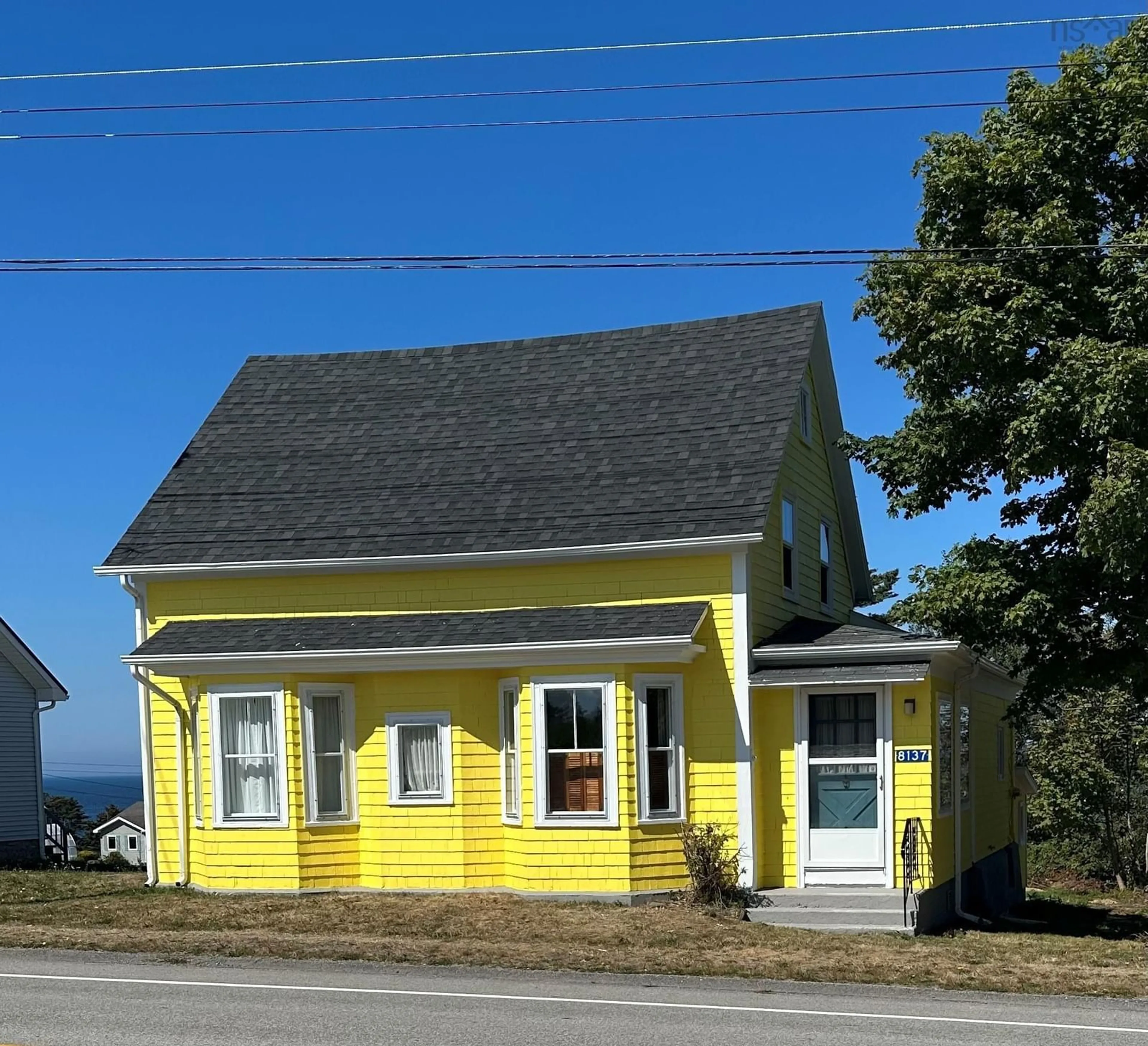 Home with vinyl exterior material, street for 8137 Highway 1, Meteghan Nova Scotia B0W 2J0