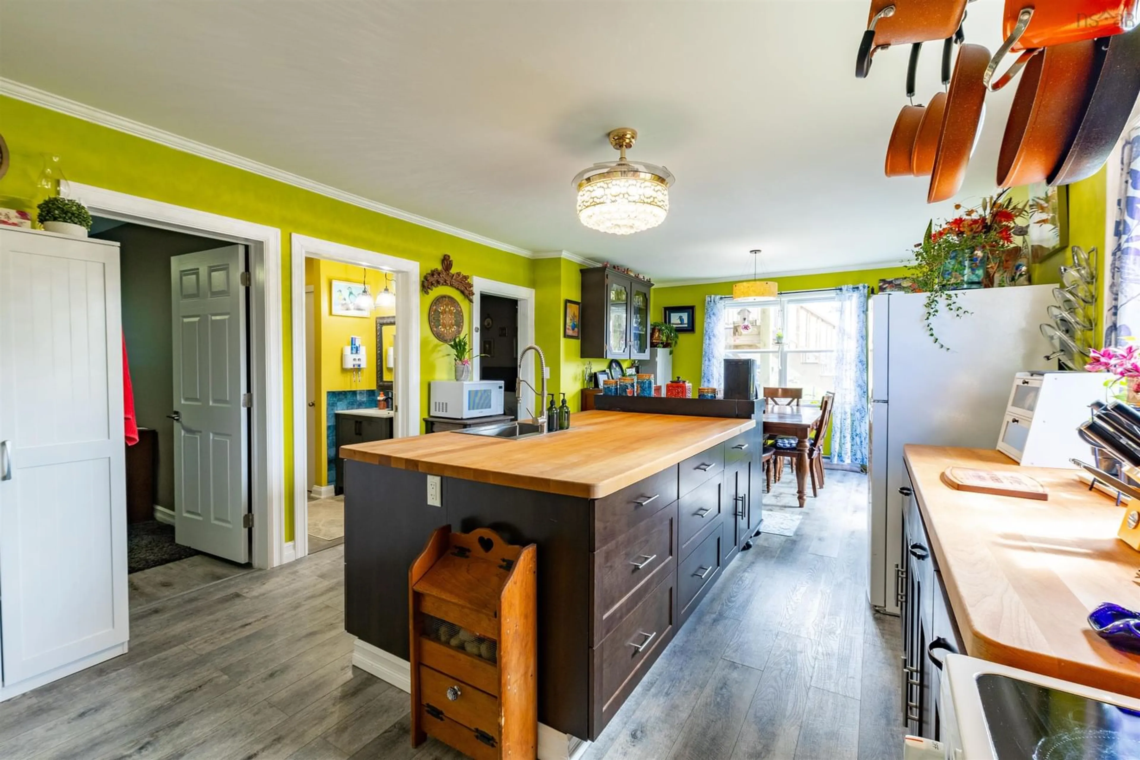 Open concept kitchen, wood/laminate floor for 6908 Highway 3, Eel Brook Nova Scotia B0W 2X0