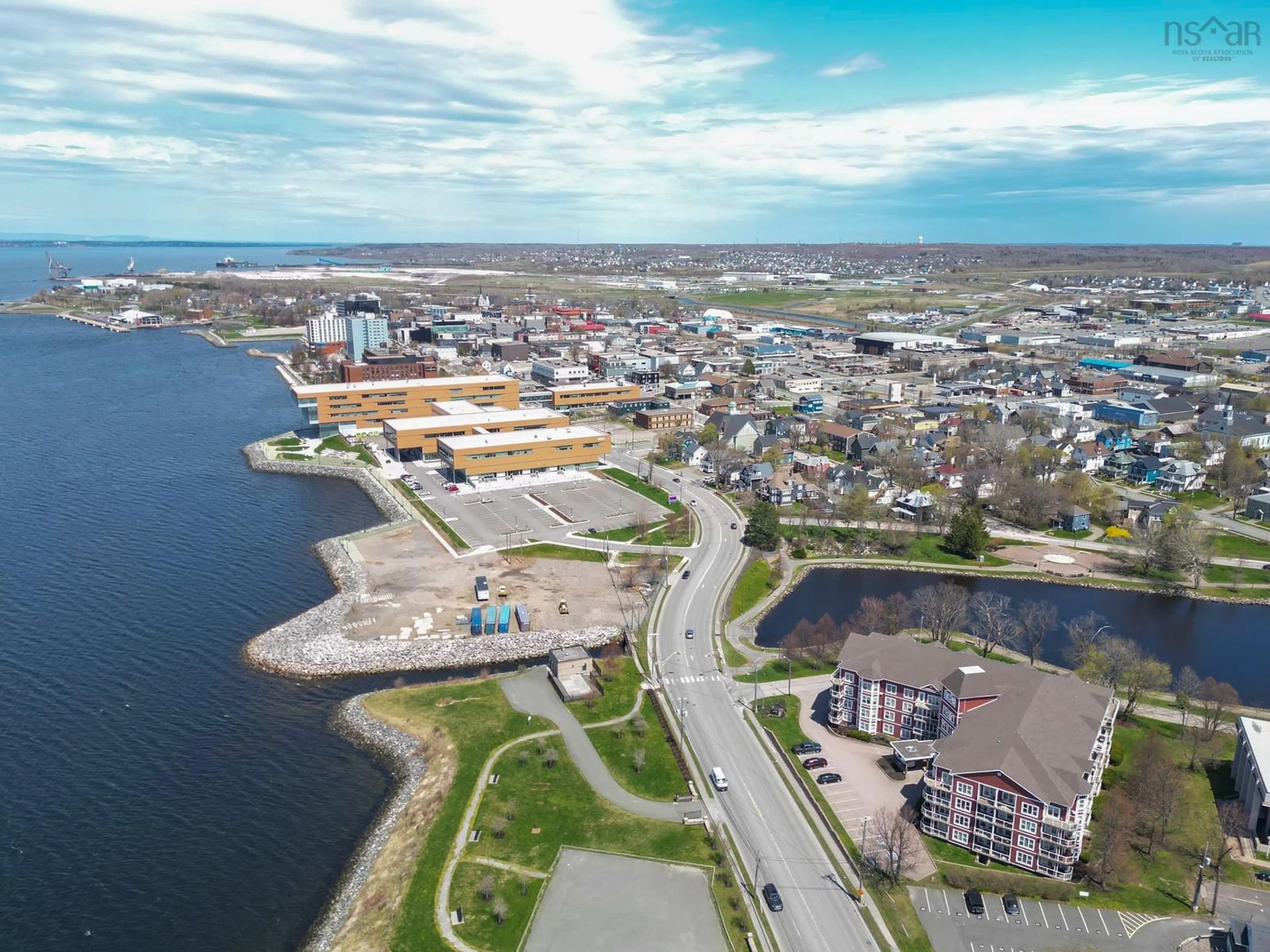 A pic from outside/outdoor area/front of a property/back of a property/a pic from drone, water/lake/river/ocean view for 118 Kings Rd, Sydney Nova Scotia B1S 1A1