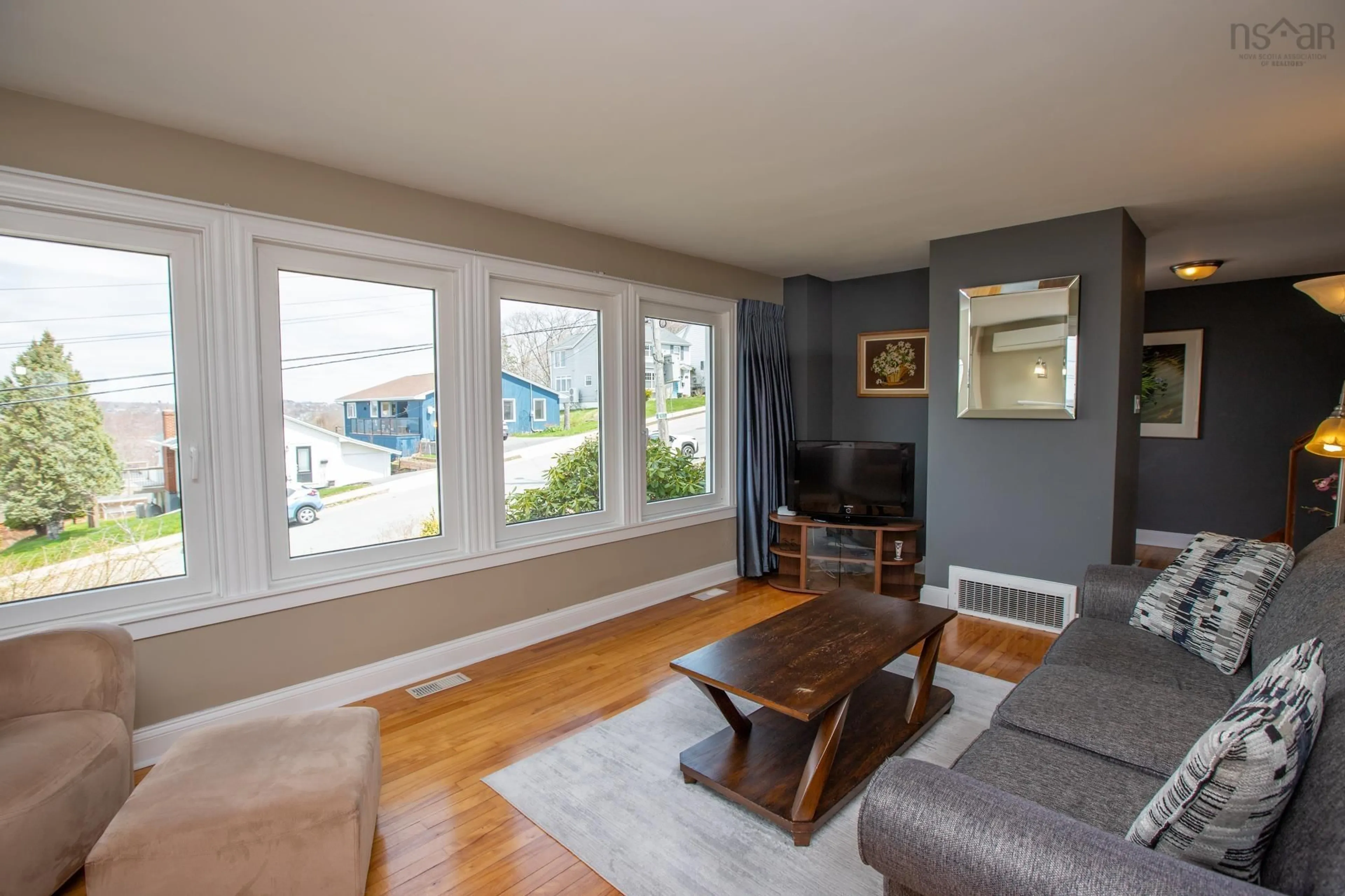 Living room with furniture, wood/laminate floor for 273 Joffre St, Dartmouth Nova Scotia B2Y 3E2