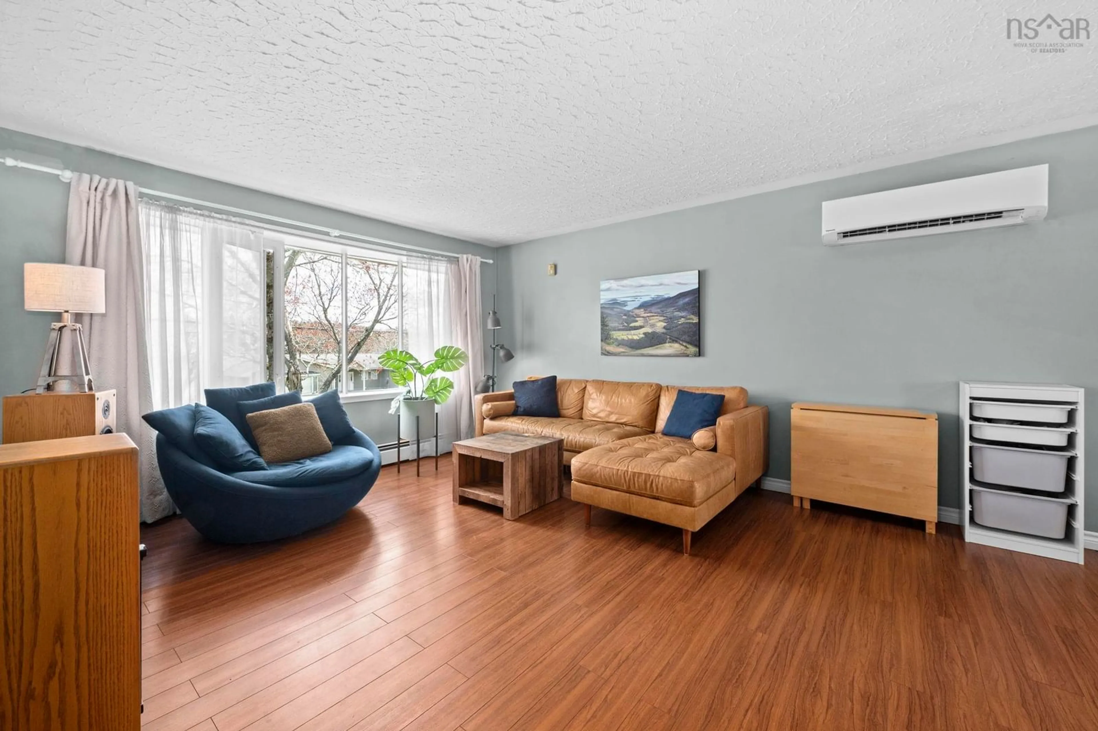 Living room with furniture, wood/laminate floor for 34 Wildwood Boulevard, Woodlawn Nova Scotia B2W 2L8