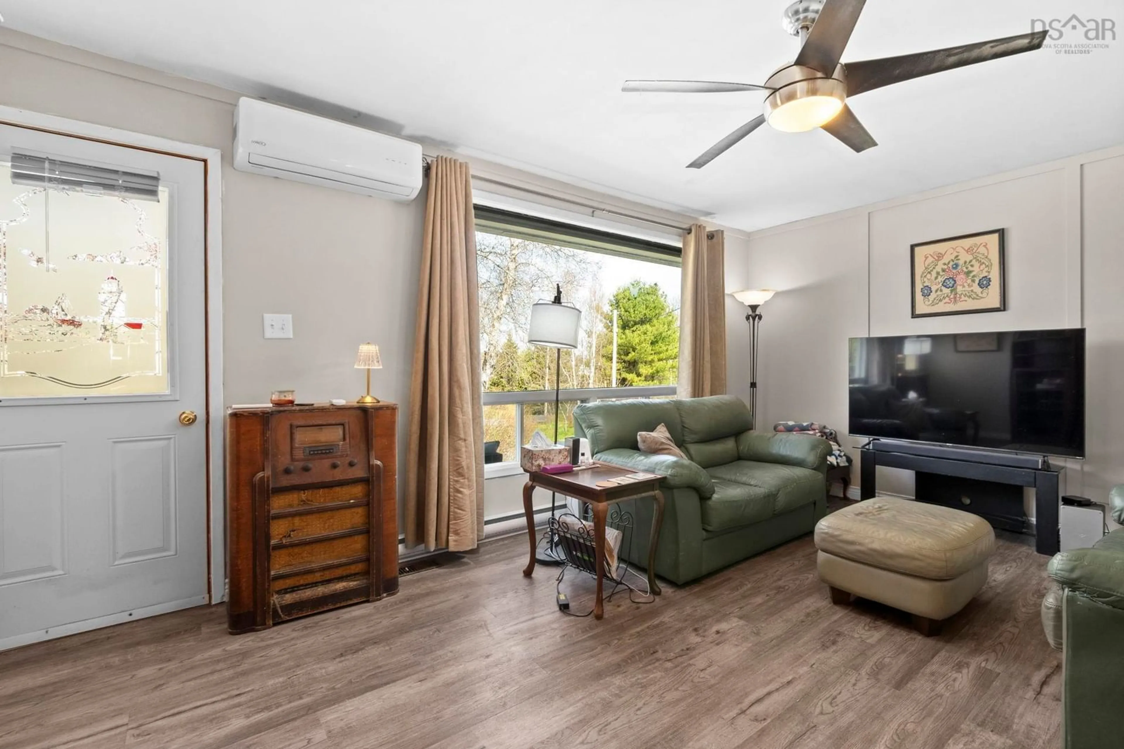 Living room with furniture, wood/laminate floor for 133 Panuke Rd, Three Mile Plains Nova Scotia B0N 2T0