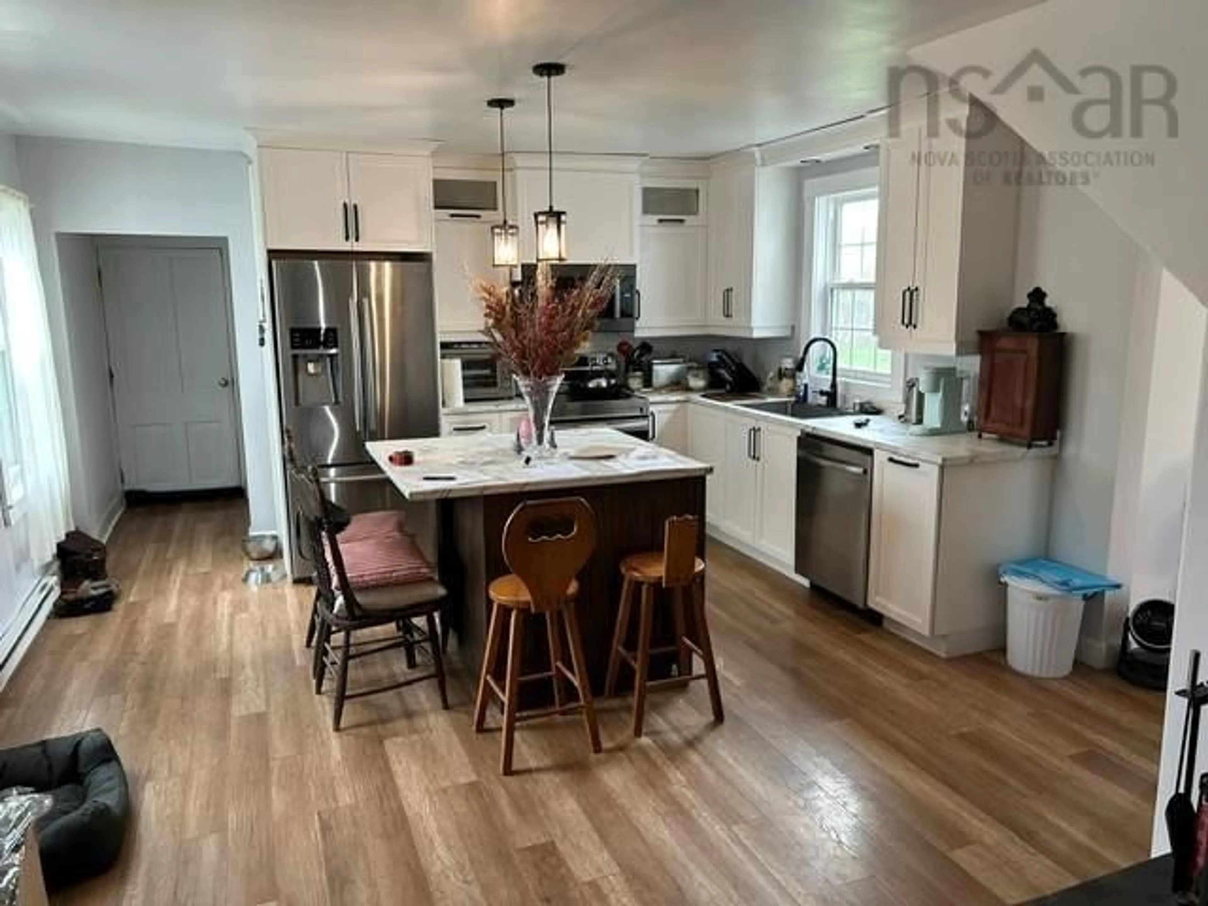 Open concept kitchen, wood/laminate floor for 8863 Highway 2, Great Village Nova Scotia B0M 1L0