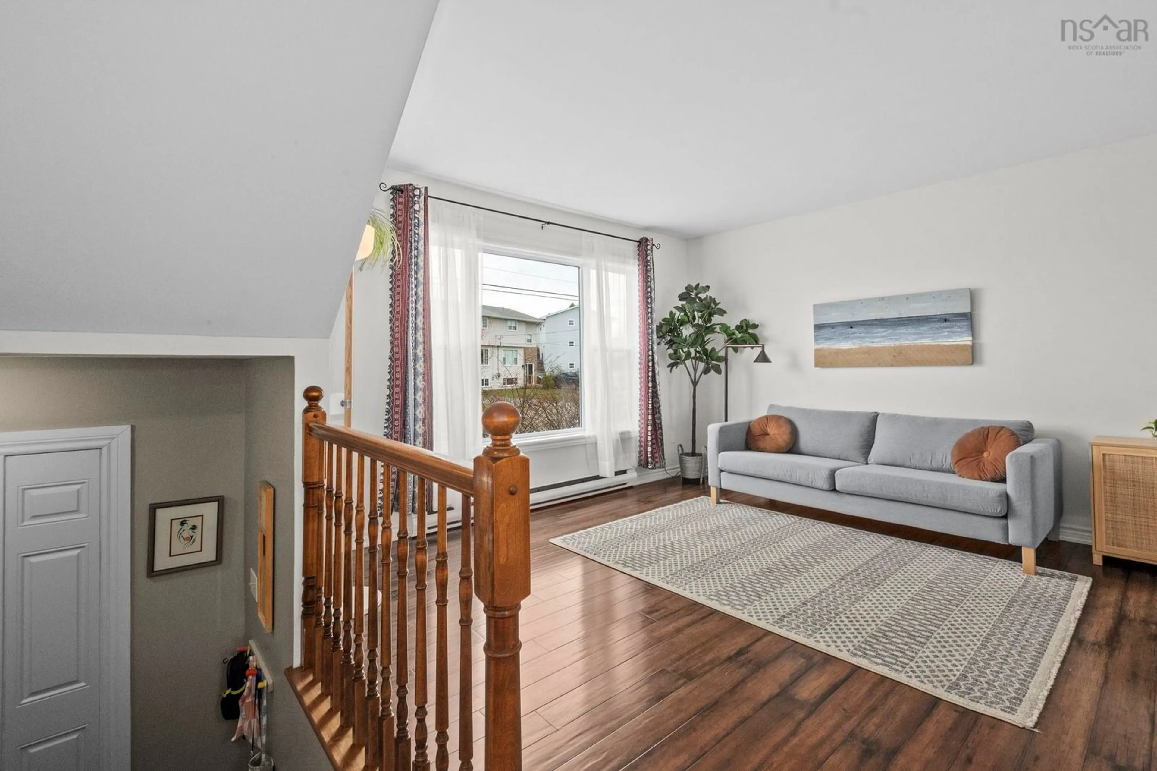 Living room with furniture, wood/laminate floor for 25 Cannon Cres, Eastern Passage Nova Scotia B3G 1E9