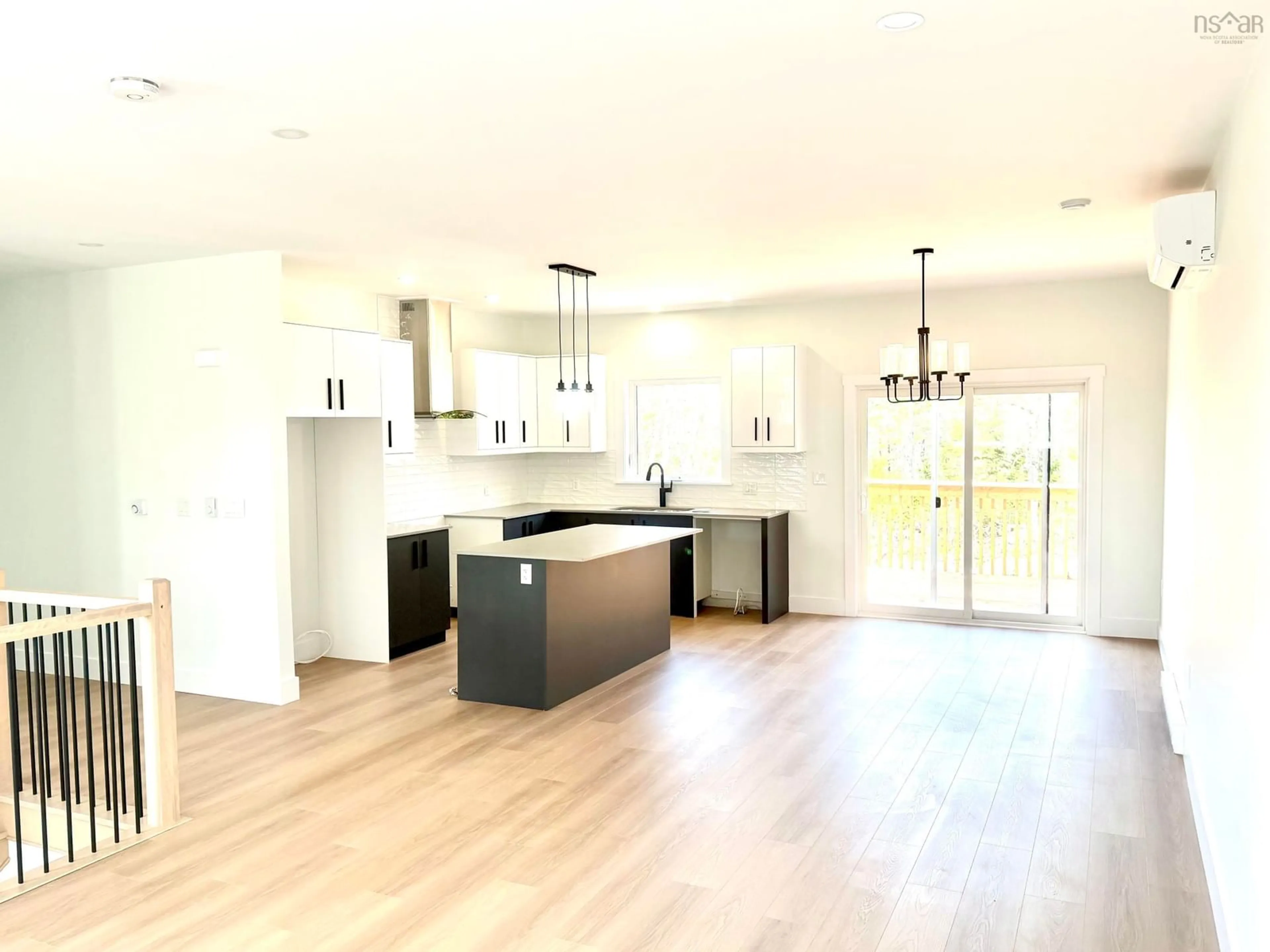 Open concept kitchen, wood/laminate floor for 32 Raihaven Lane, Whites Lake Nova Scotia B3T 1V6
