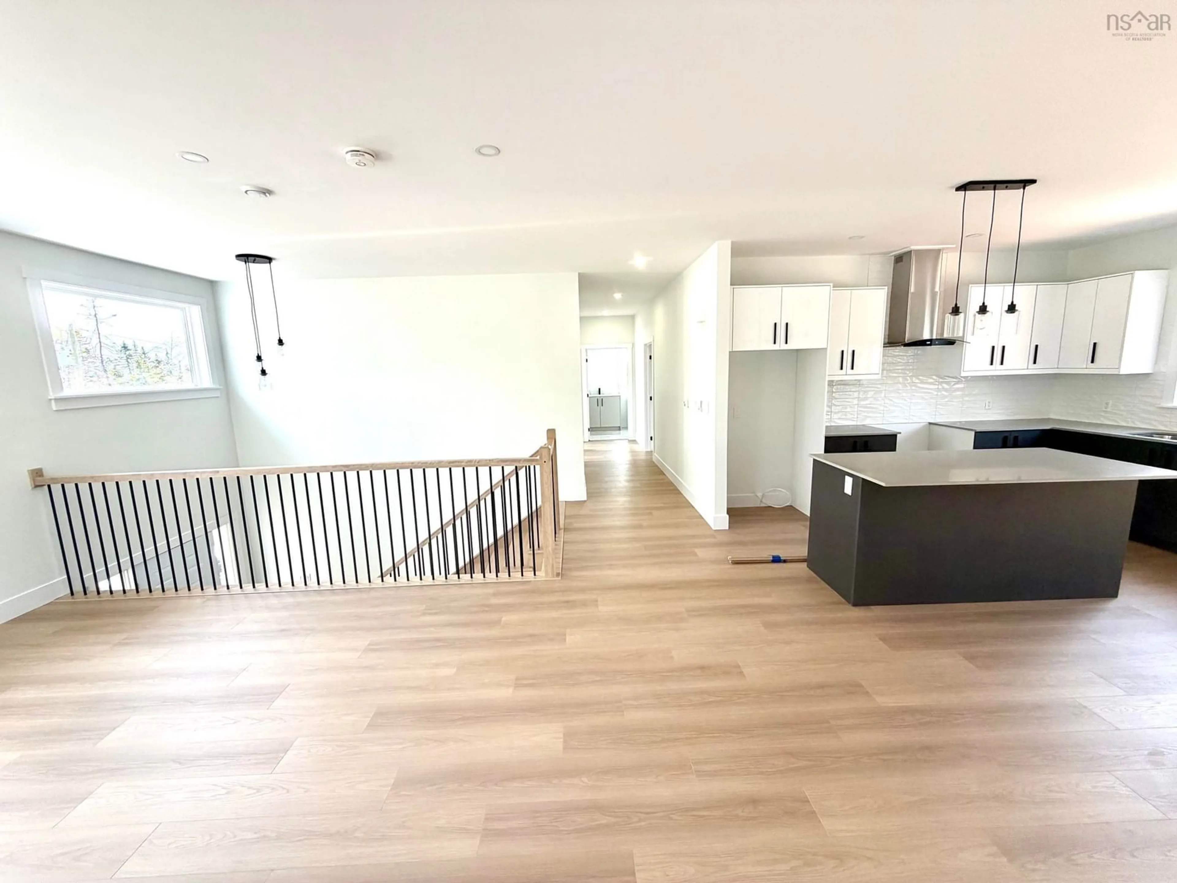Open concept kitchen, wood/laminate floor for 32 Raihaven Lane, Whites Lake Nova Scotia B3T 1V6