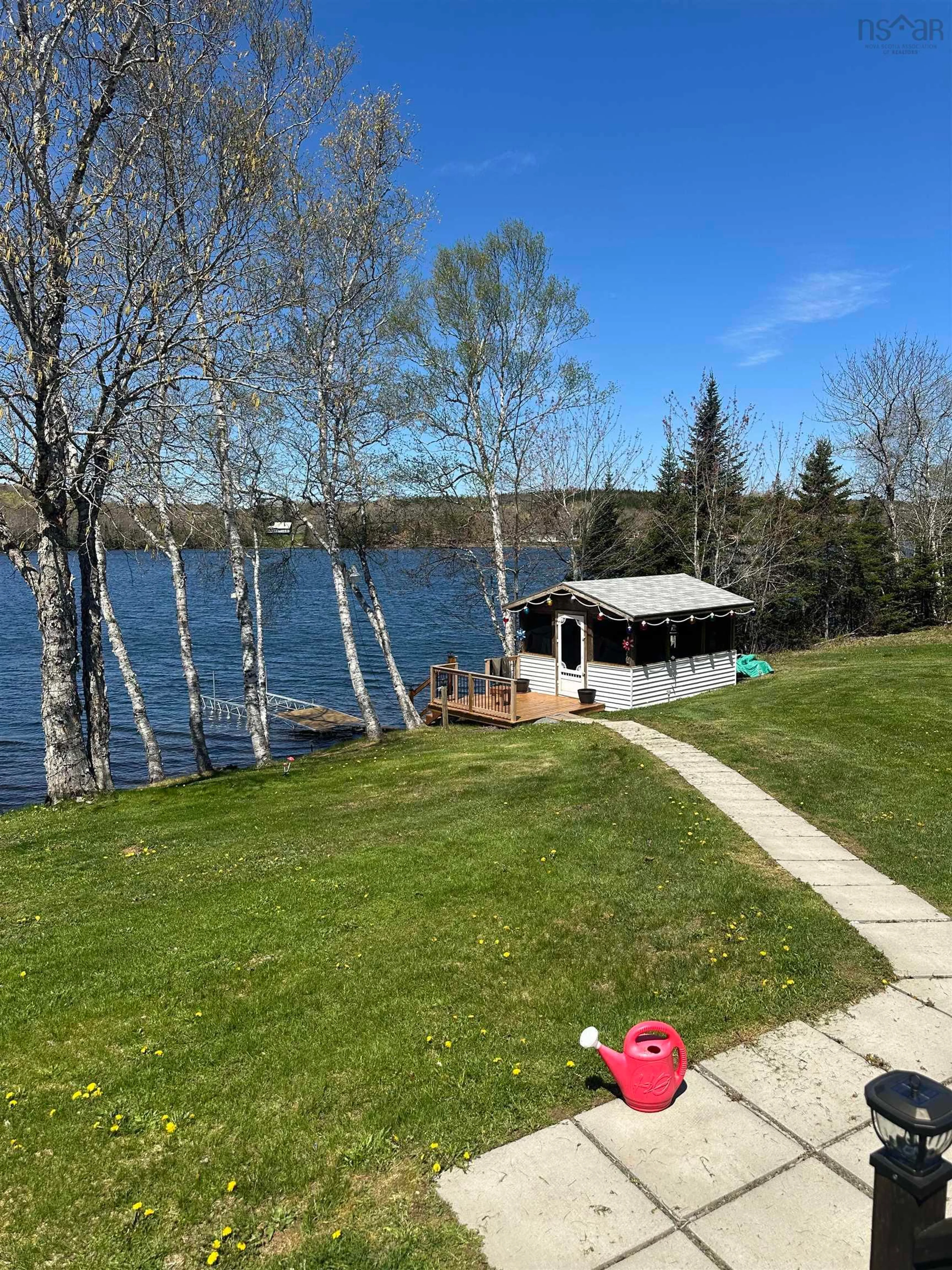 A pic from outside/outdoor area/front of a property/back of a property/a pic from drone, water/lake/river/ocean view for 102 Penny Lane, Arichat Nova Scotia B0H 1M0