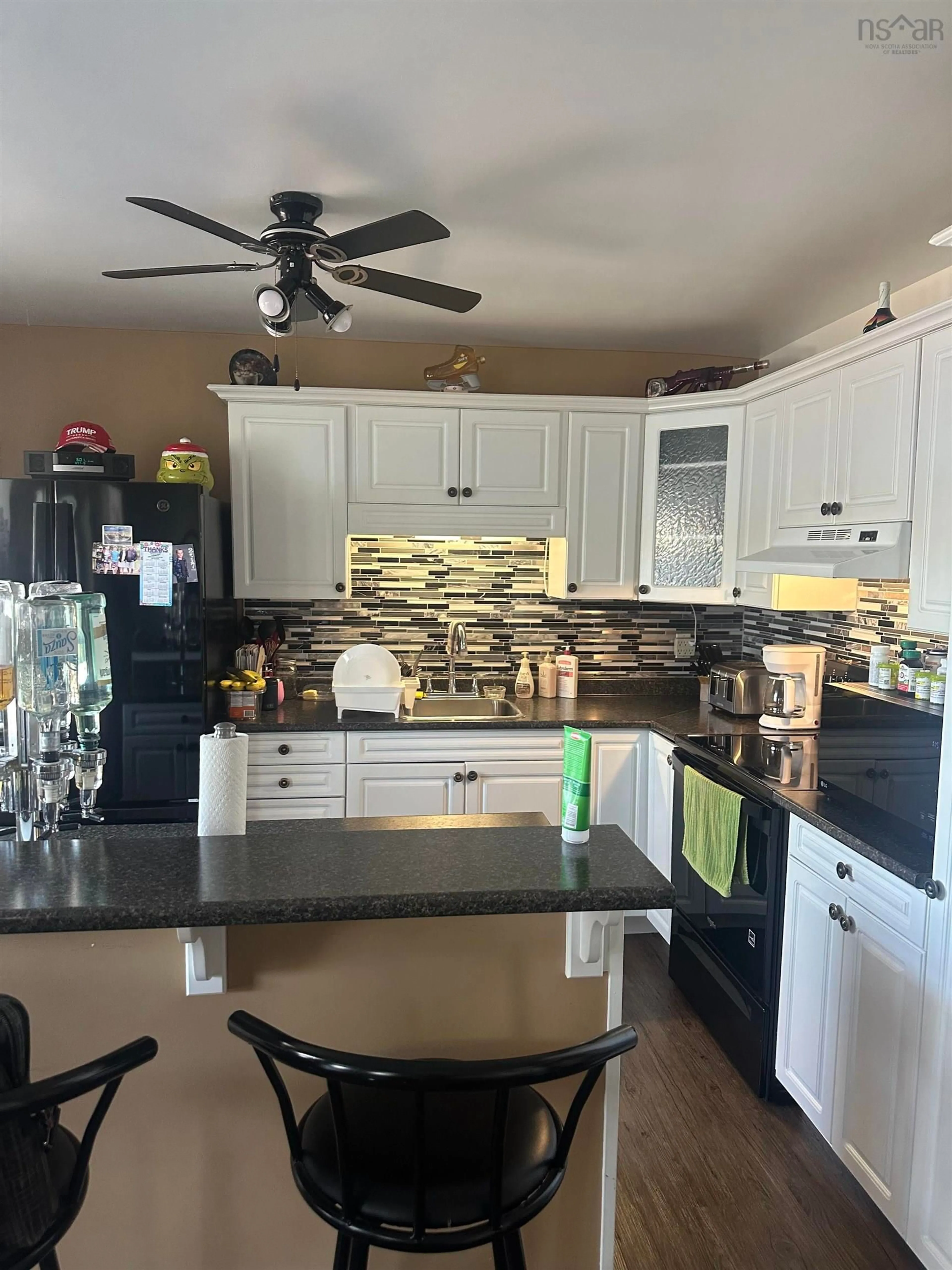 Open concept kitchen, ceramic/tile floor for 102 Penny Lane, Arichat Nova Scotia B0H 1M0