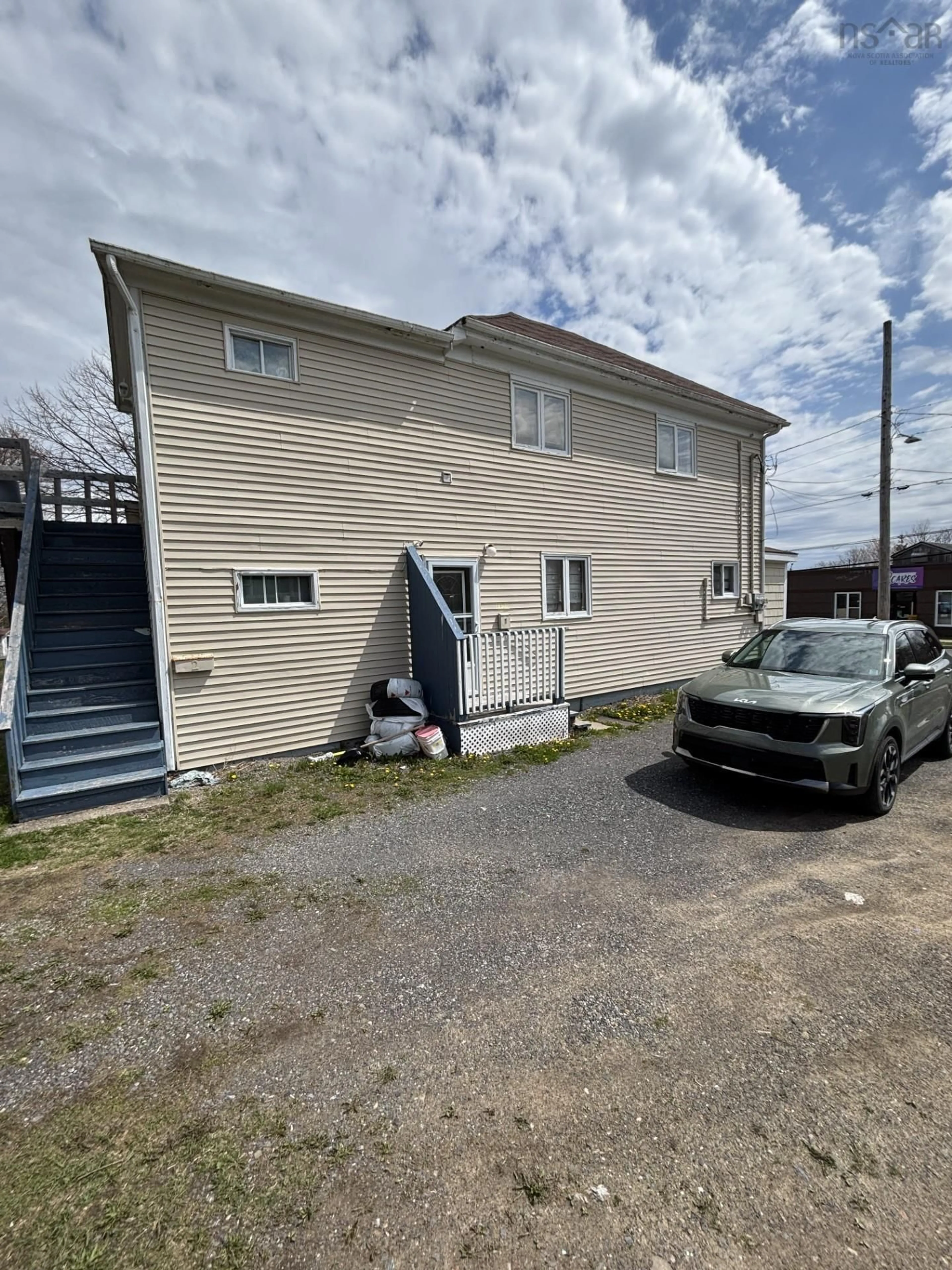 A pic from outside/outdoor area/front of a property/back of a property/a pic from drone, building for 56 King St, Sydney Mines Nova Scotia B1V 1L8
