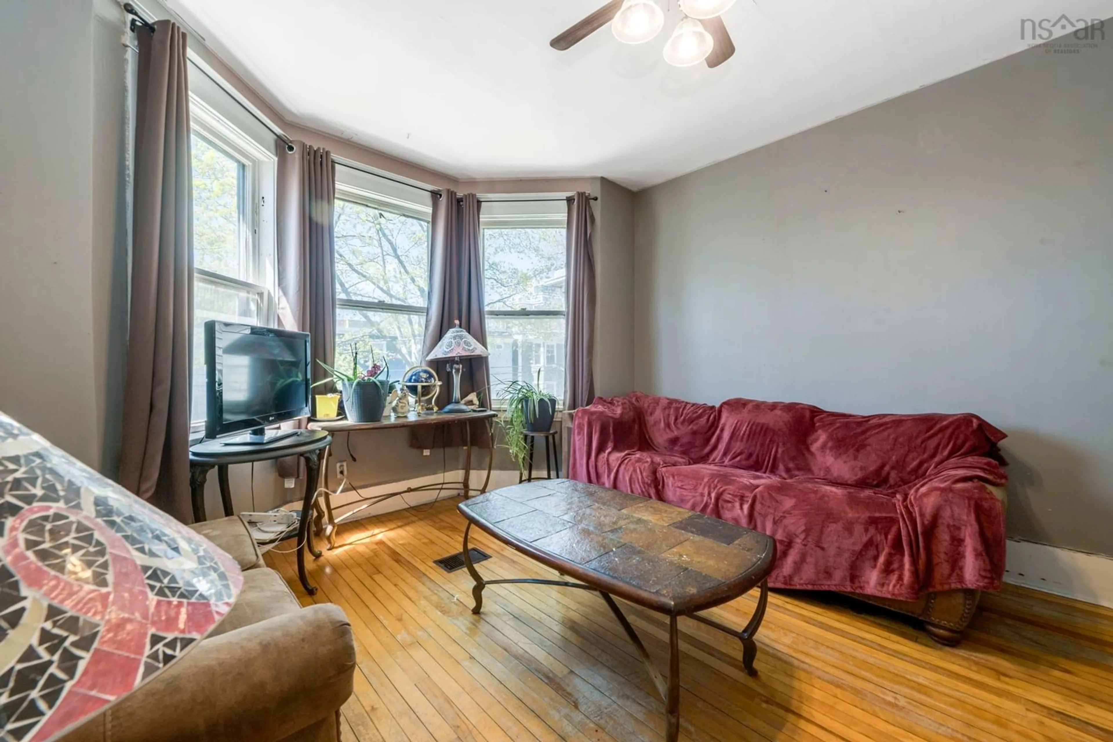 Living room with furniture, wood/laminate floor for 2627/2629 Fuller Terr, Halifax Nova Scotia B3K 3V8