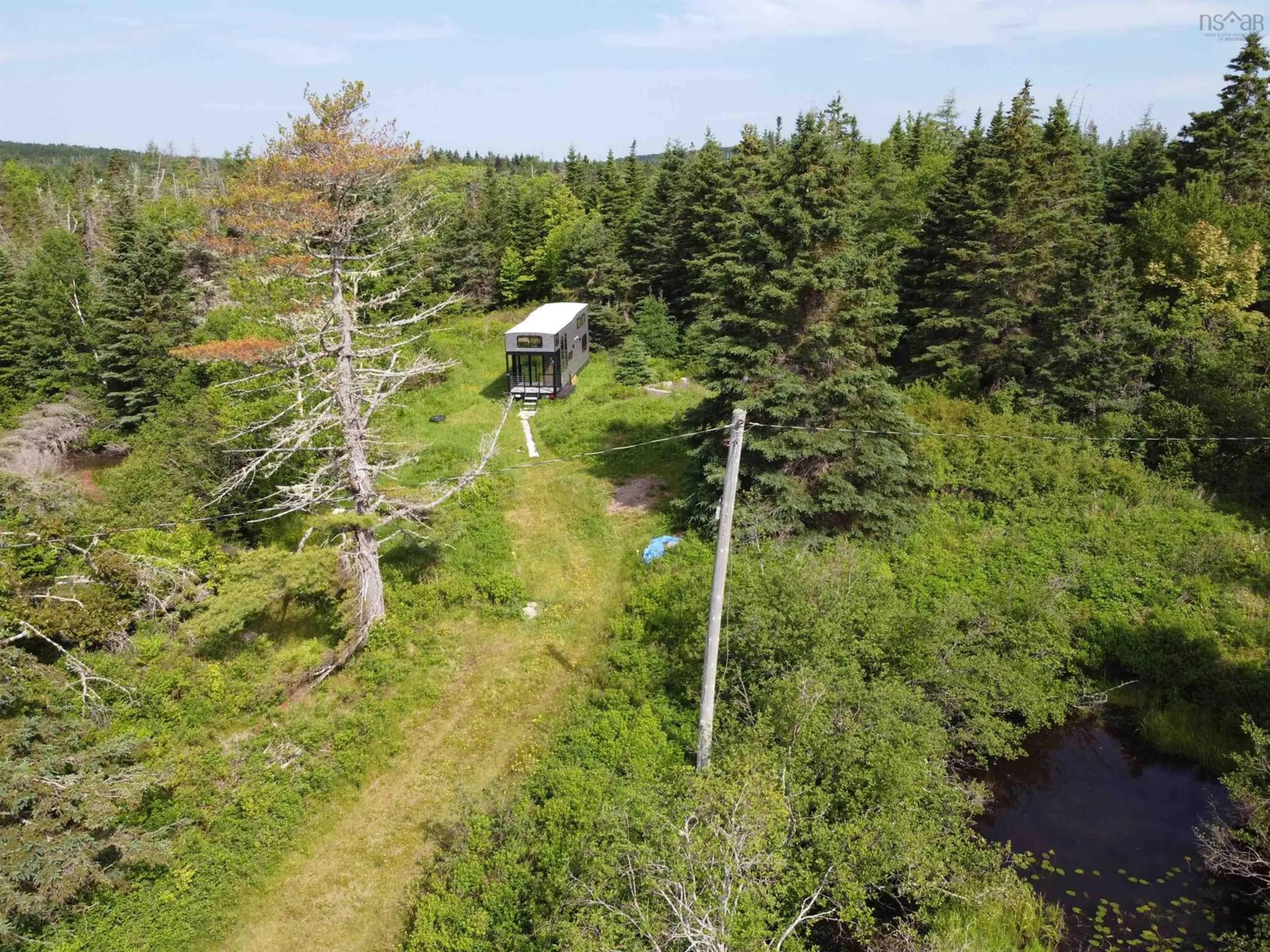 A pic from outside/outdoor area/front of a property/back of a property/a pic from drone, forest/trees view for 24 Englehutt Rd, Moser River Nova Scotia B0J 2R0
