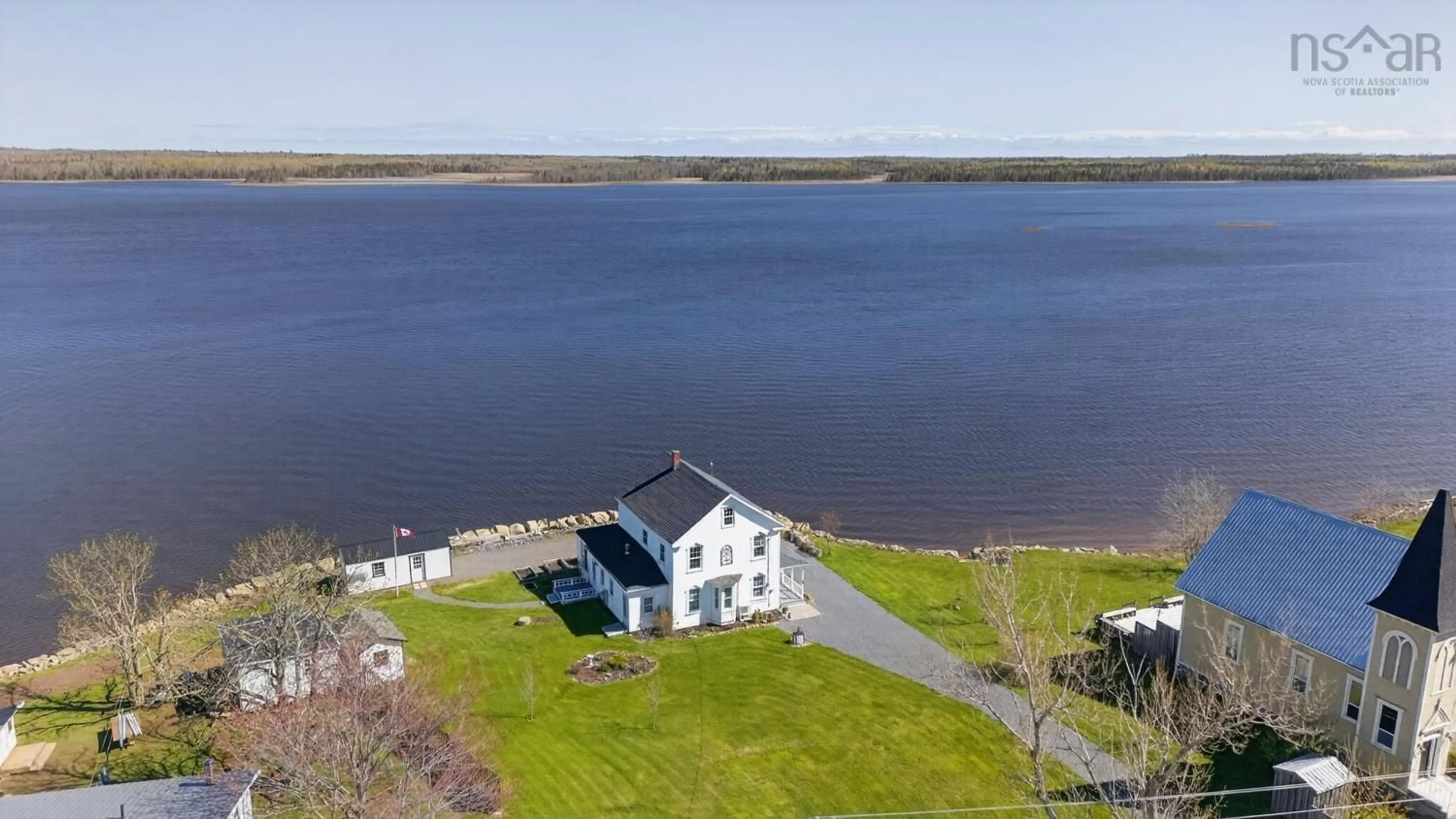 A pic from outside/outdoor area/front of a property/back of a property/a pic from drone, water/lake/river/ocean view for 13291 Highway 6, Wallace Bridge Nova Scotia B0K 1Y0
