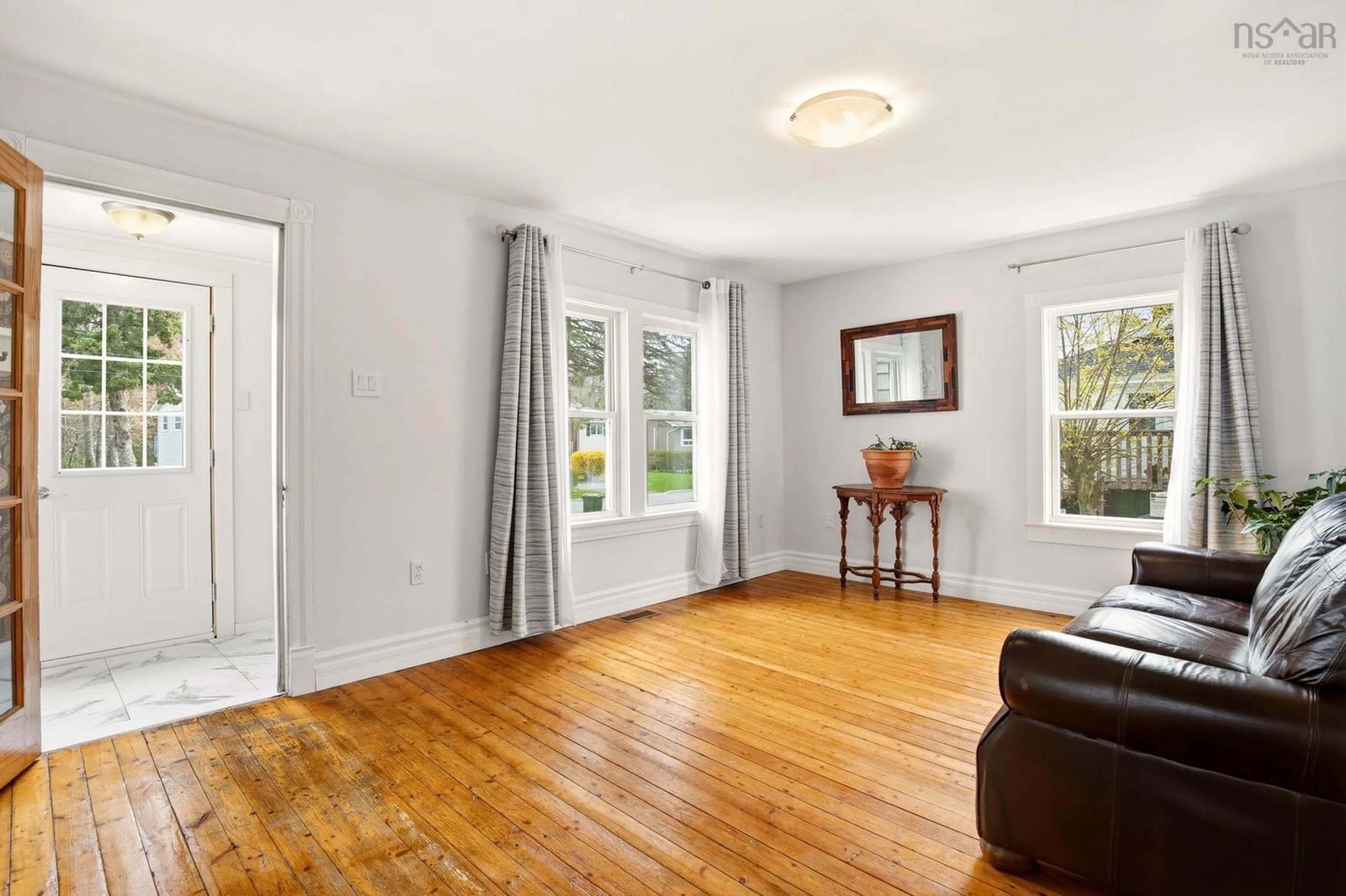 Living room with furniture, wood/laminate floor for 27 Stone Terr, Bedford Nova Scotia B4A 2G7