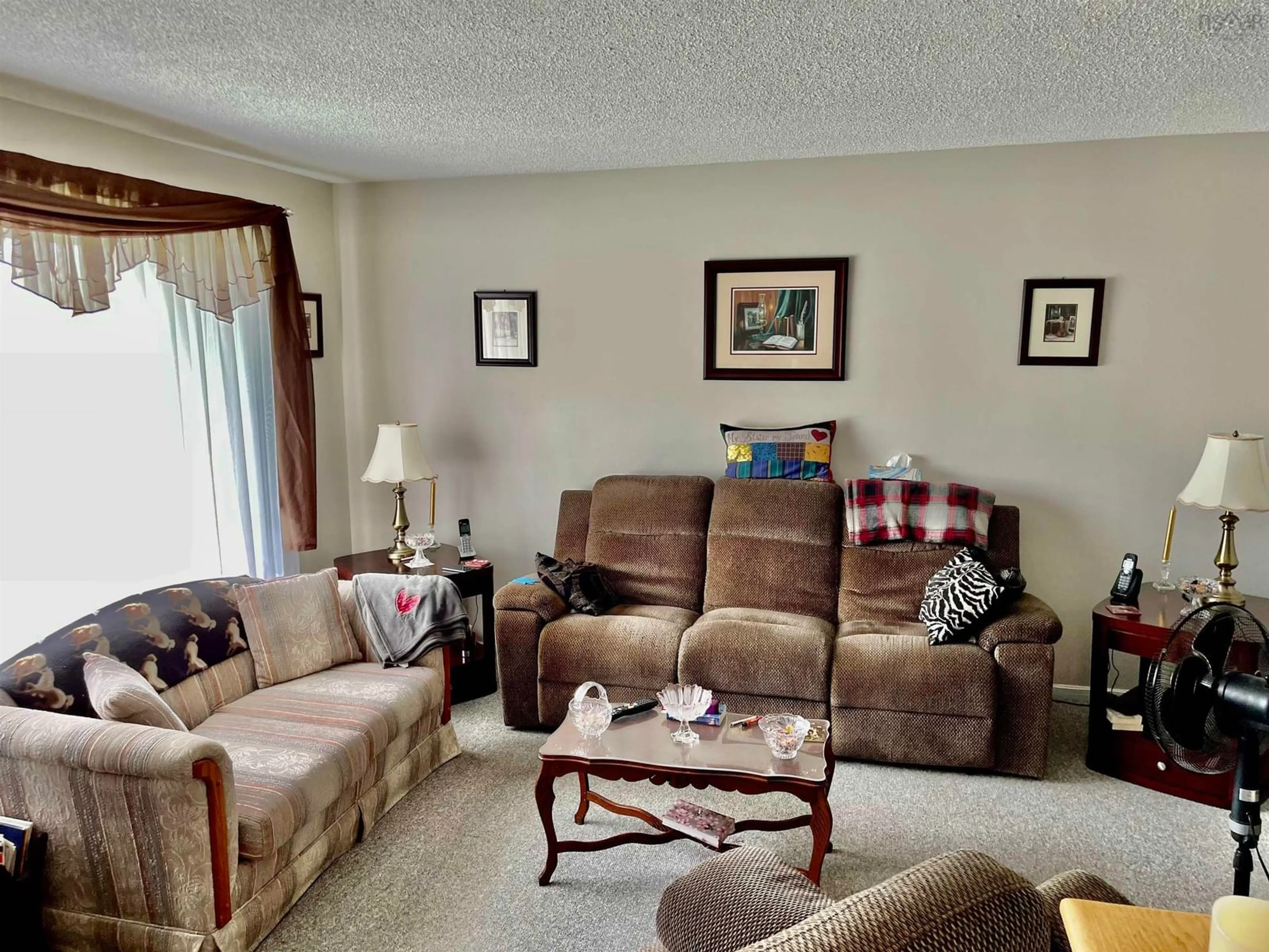 Living room with furniture, unknown for 122 William St, Sydney Mines Nova Scotia B1V 3A2