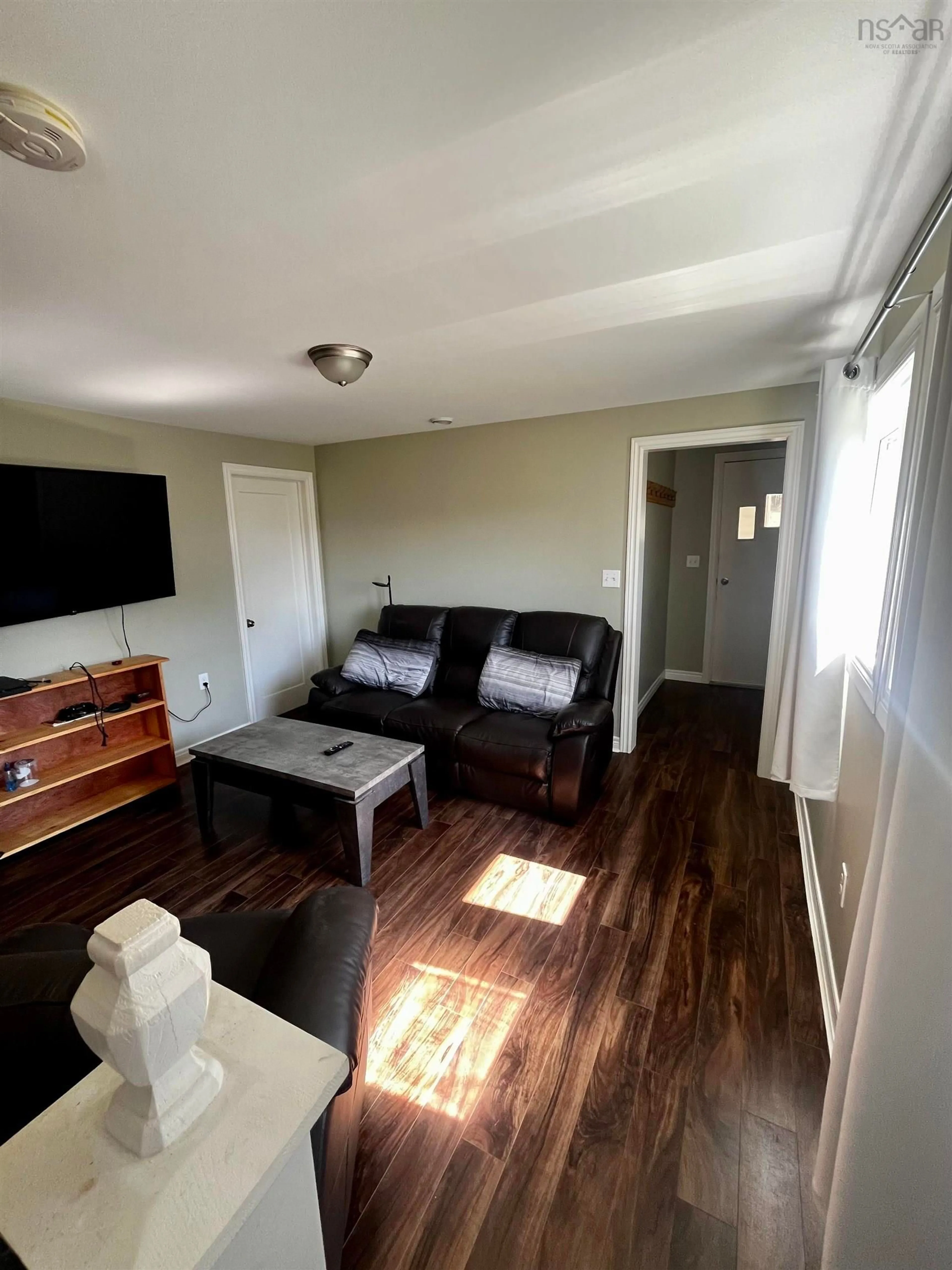 Living room with furniture, wood/laminate floor for 567 Little Brook Rd, Little Brook Station Nova Scotia B0W 1M0