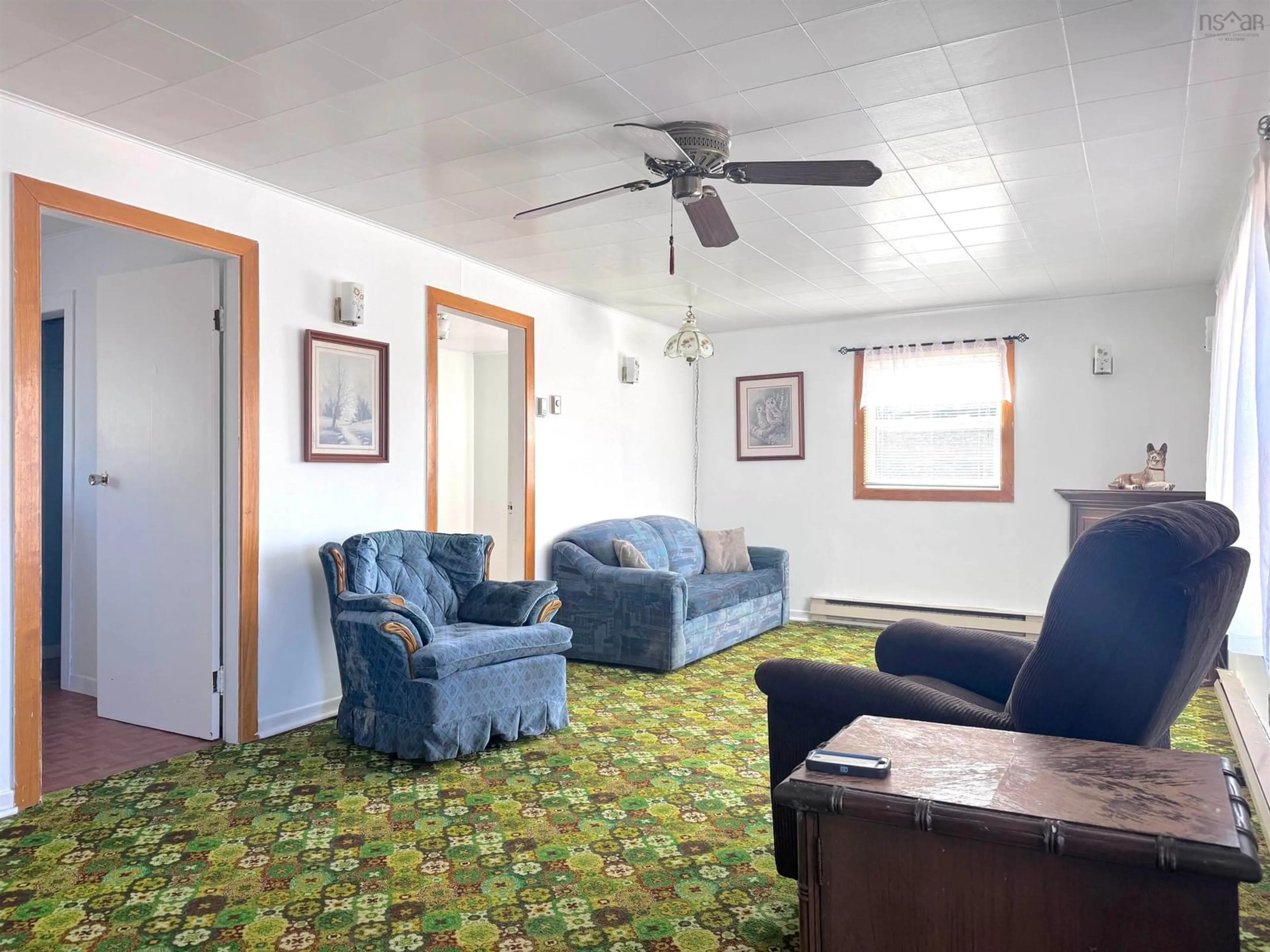 Living room with furniture, carpet floor for 568 Dingwall Rd, Dingwall Nova Scotia B0C 1G0