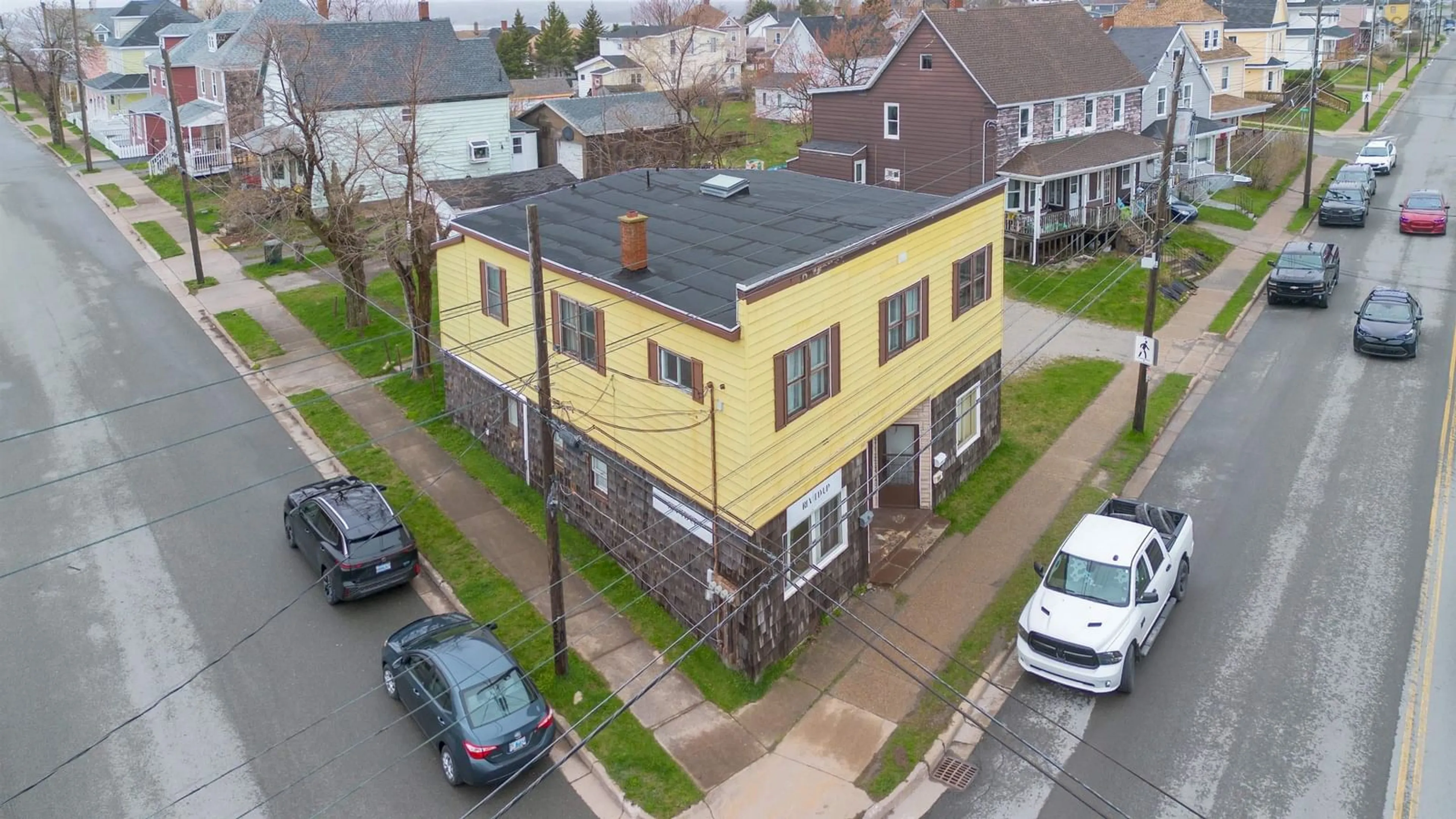 A pic from outside/outdoor area/front of a property/back of a property/a pic from drone, building for 757 Victoria Rd, Sydney Nova Scotia B1N 1J5