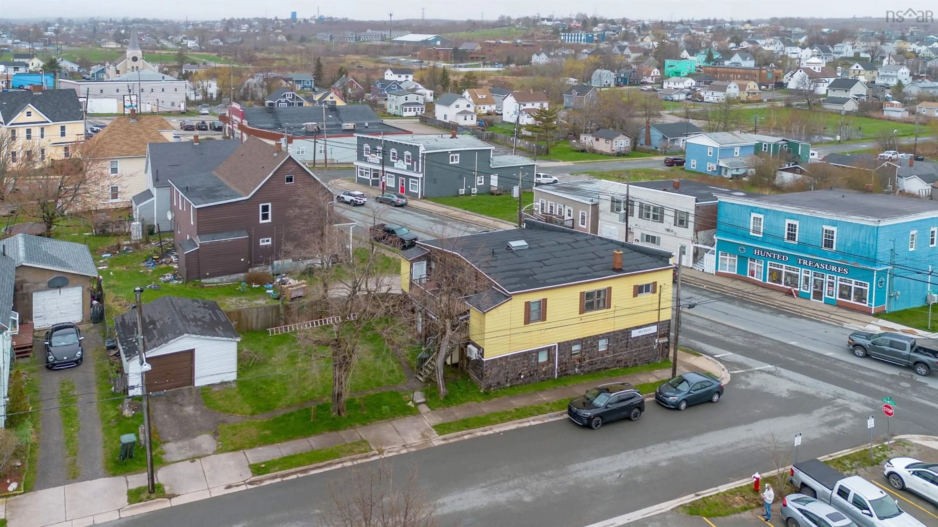 A pic from outside/outdoor area/front of a property/back of a property/a pic from drone, street for 757 Victoria Rd, Sydney Nova Scotia B1N 1J5