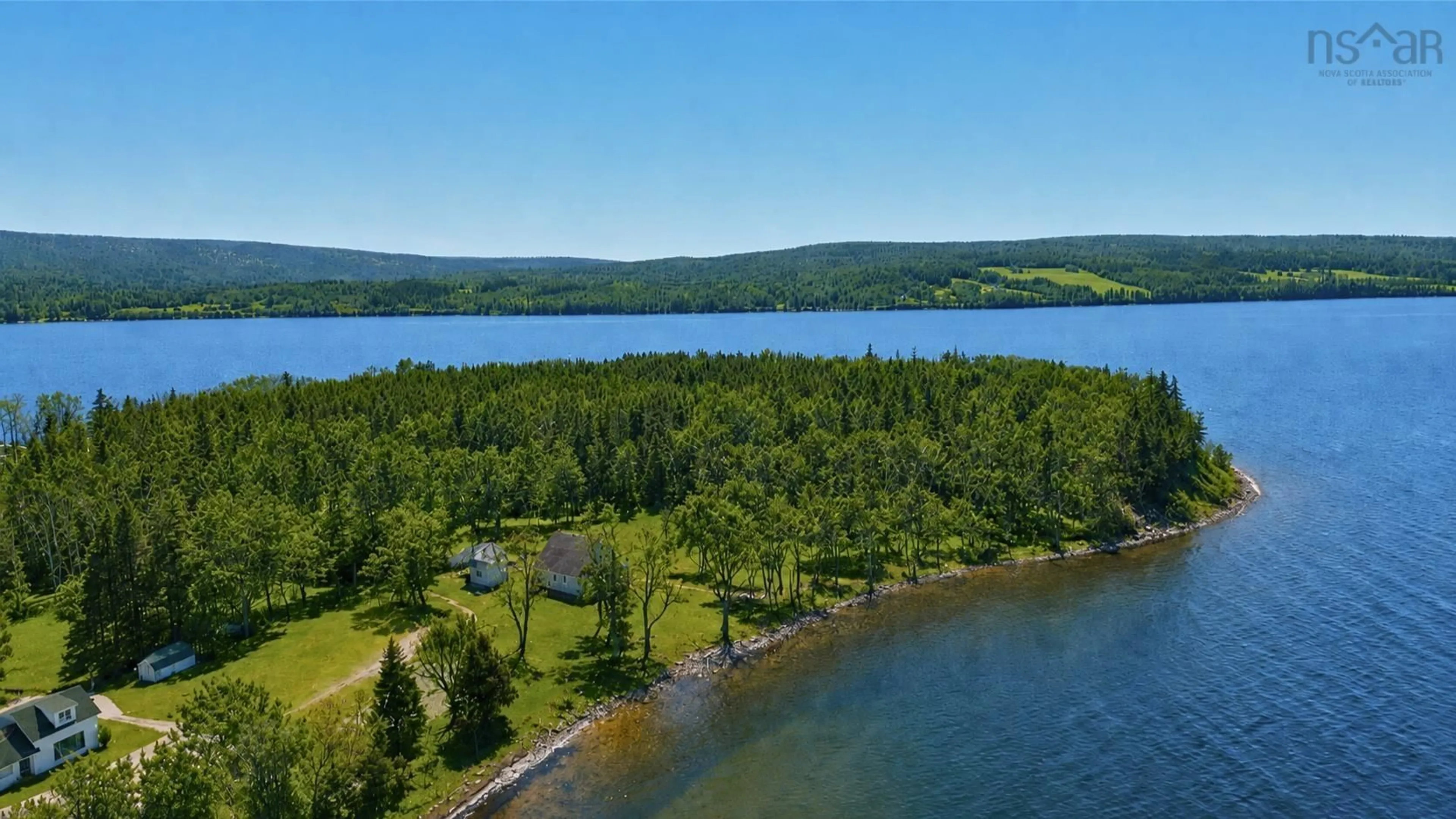 A pic from outside/outdoor area/front of a property/back of a property/a pic from drone, water/lake/river/ocean view for 348 395 Highway, East Lake Ainslie Nova Scotia B0E 3M0