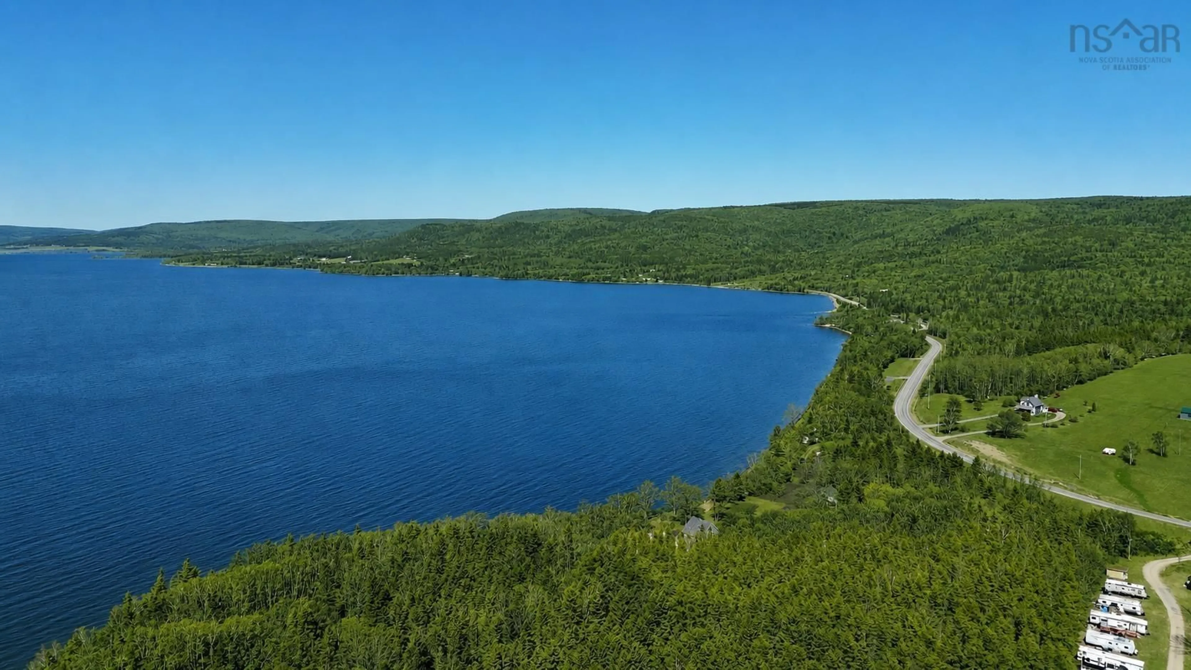 A pic from outside/outdoor area/front of a property/back of a property/a pic from drone, water/lake/river/ocean view for 348 395 Highway, East Lake Ainslie Nova Scotia B0E 3M0