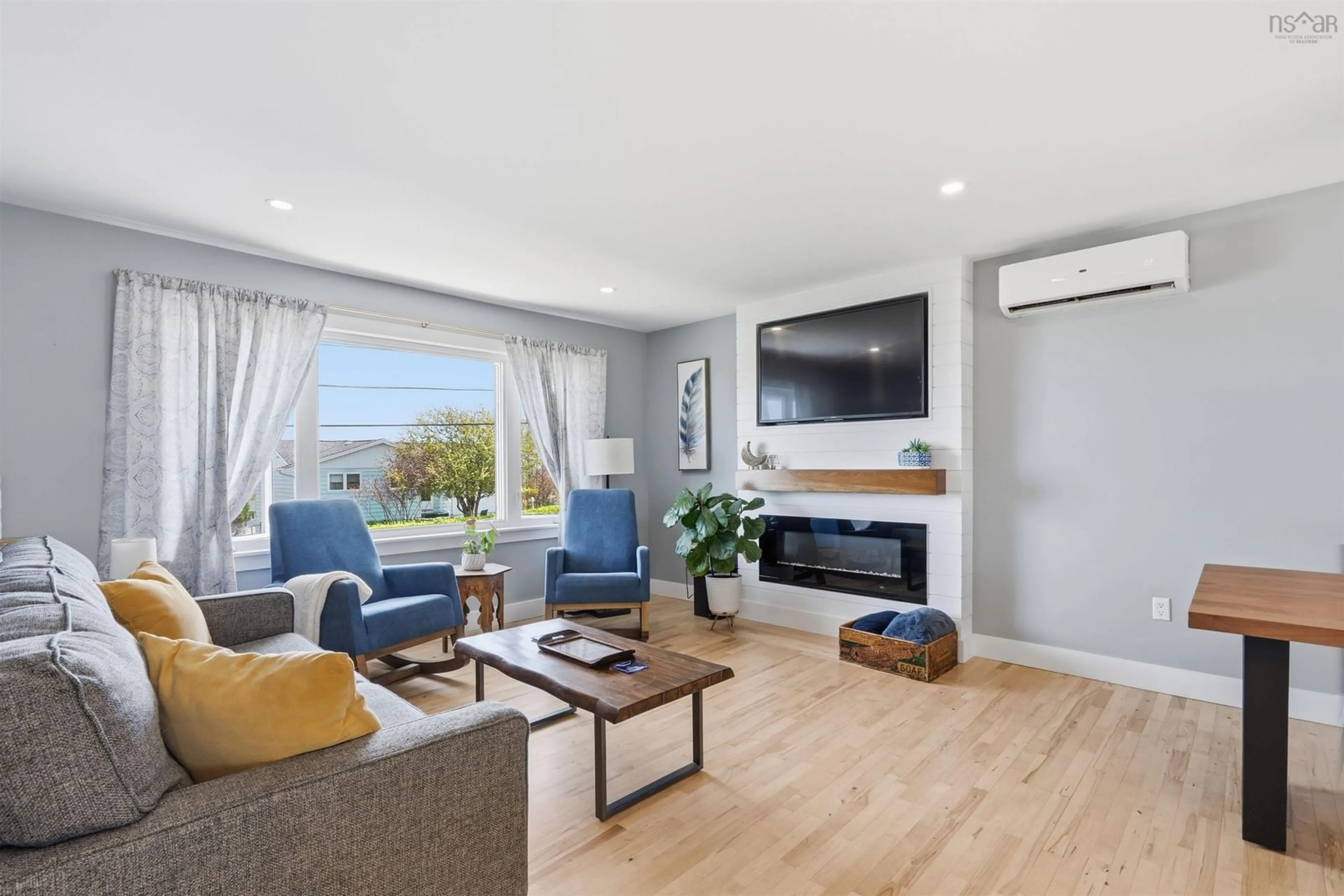 Living room with furniture, wood/laminate floor for 89 Sirius Cres, Dartmouth Nova Scotia B2W 4L4