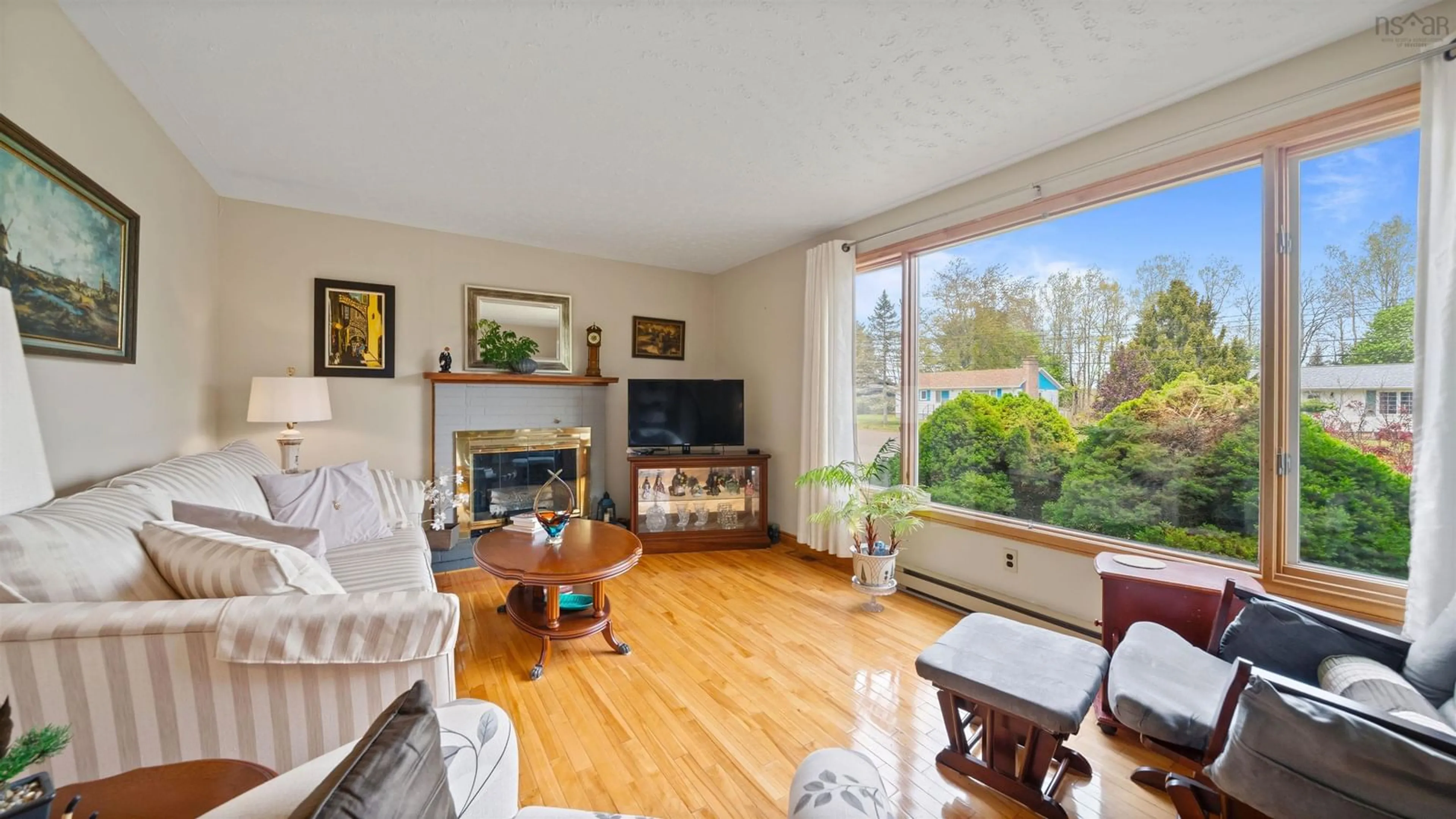 Living room with furniture, wood/laminate floor for 1134 Aalders Ave, New Minas Nova Scotia B4N 3H5