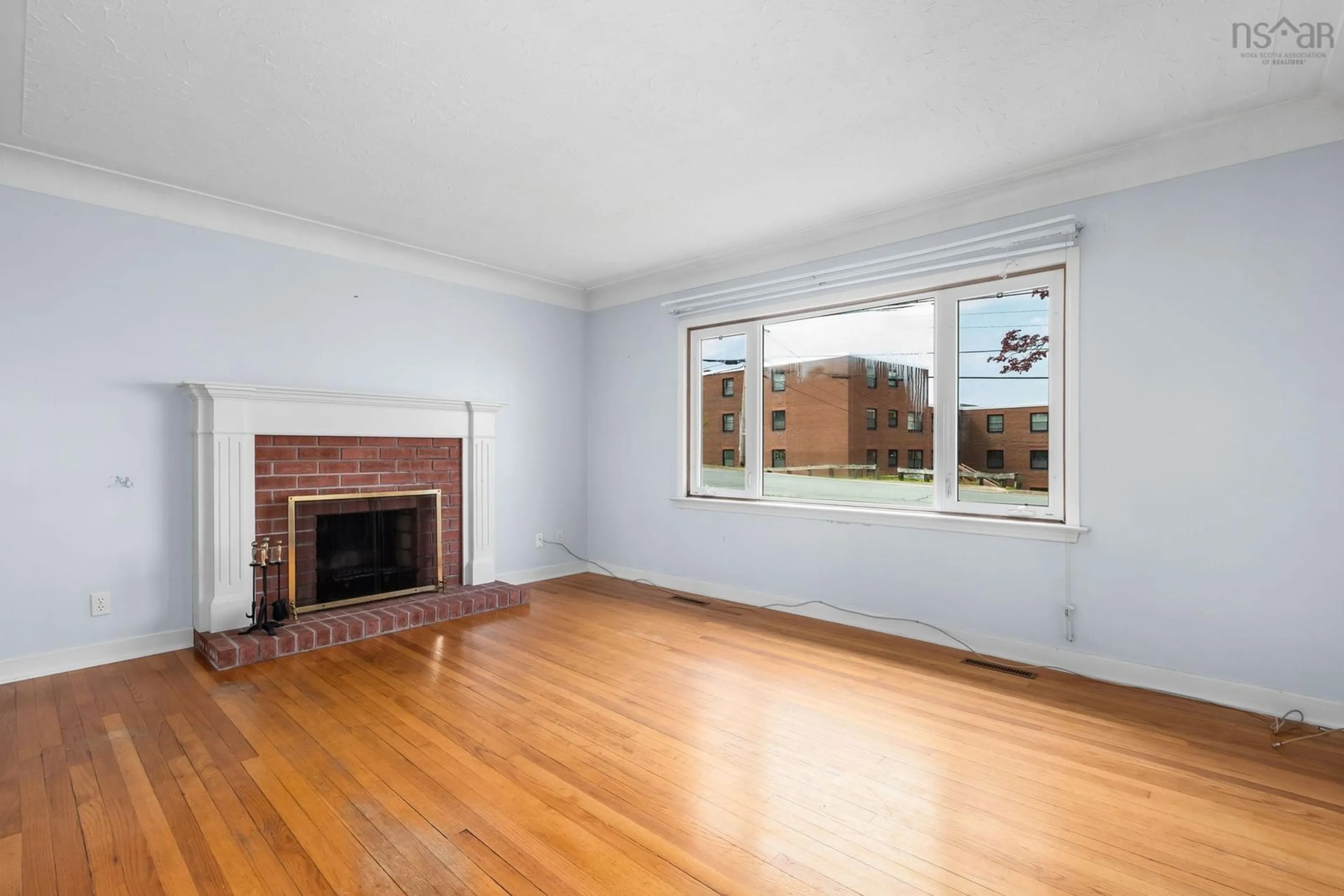 Living room with furniture, wood/laminate floor for 92 Joffre St, Dartmouth Nova Scotia B2Y 3C9