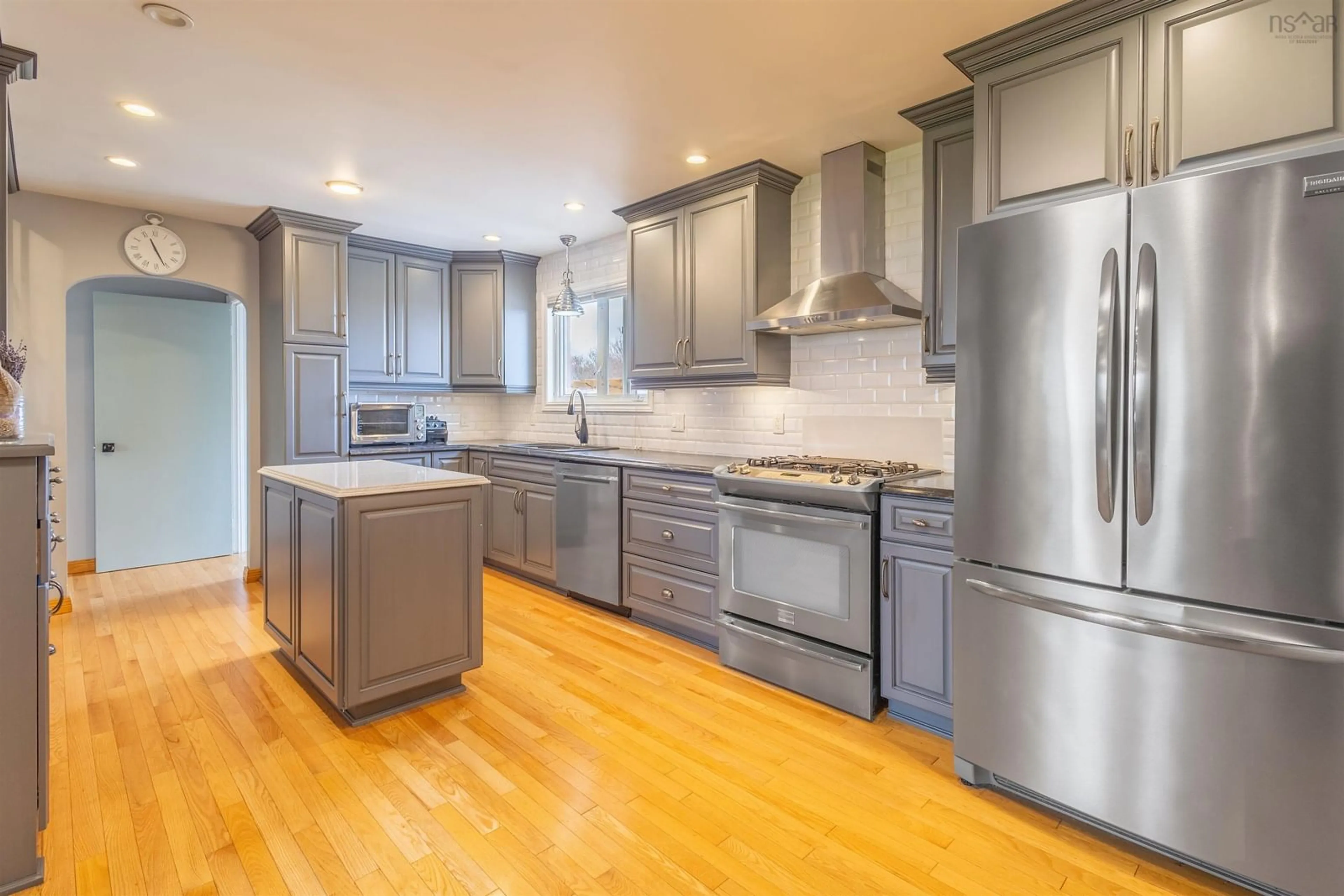 Open concept kitchen, wood/laminate floor for 1242 George St, Sydney Nova Scotia B1P 1N2