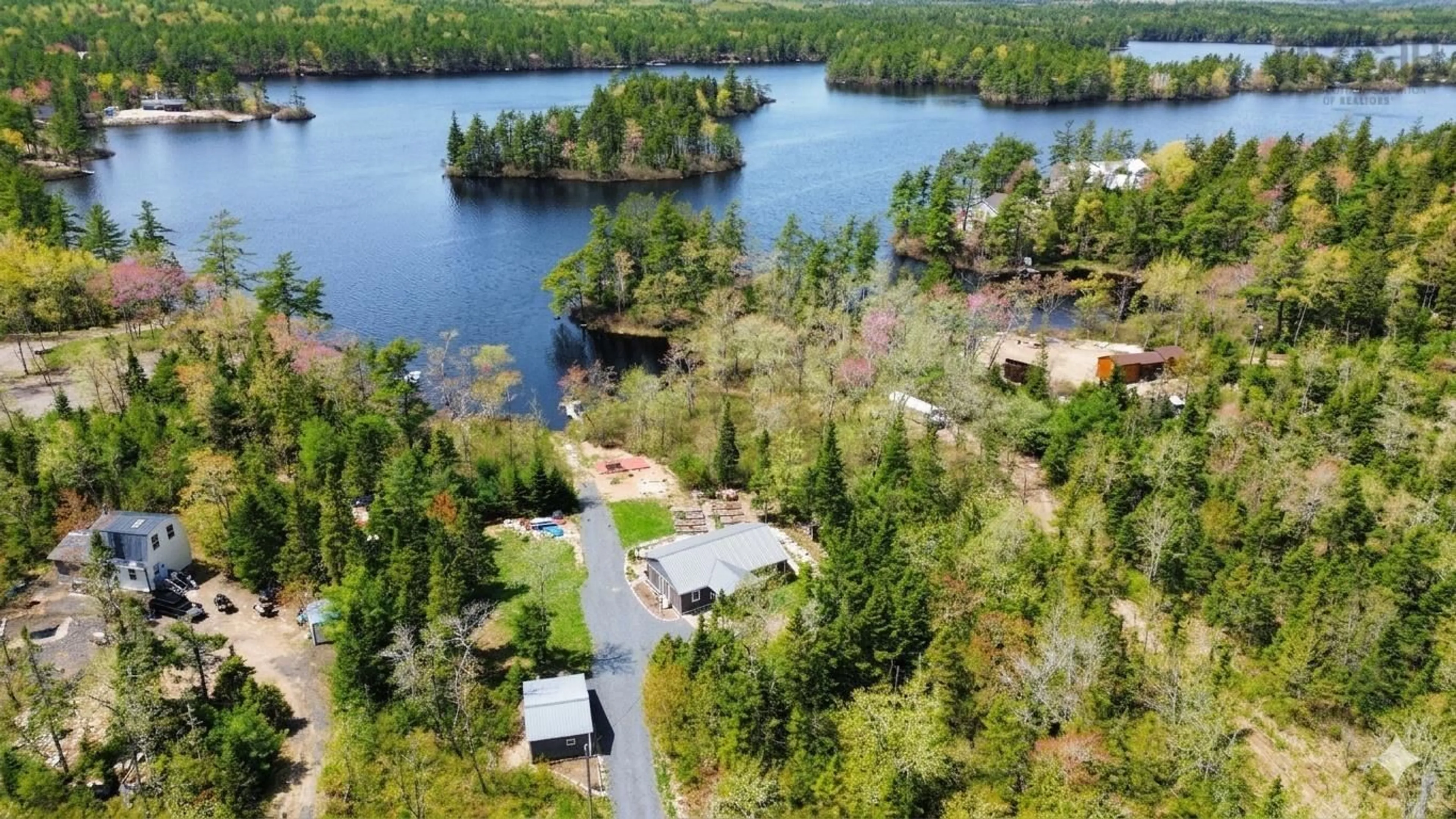 A pic from outside/outdoor area/front of a property/back of a property/a pic from drone, water/lake/river/ocean view for 8 Alexander Ave, Waterloo Lake Nova Scotia B0S 1P0