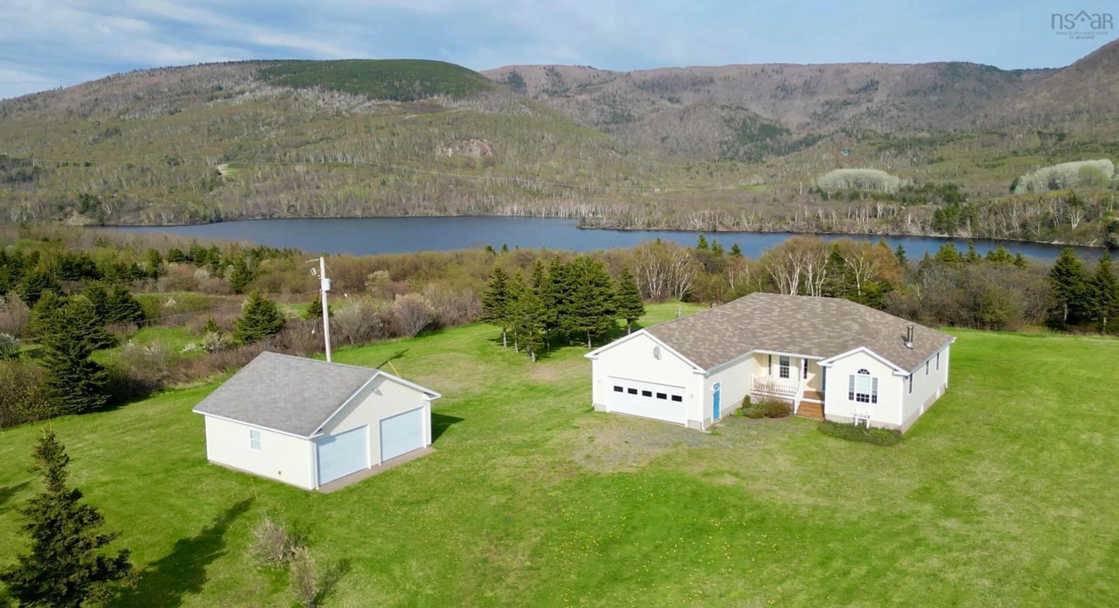 A pic from outside/outdoor area/front of a property/back of a property/a pic from drone, water/lake/river/ocean view for 13540 Cabot Trail Road, Grand Étang Nova Scotia B0E 1L0