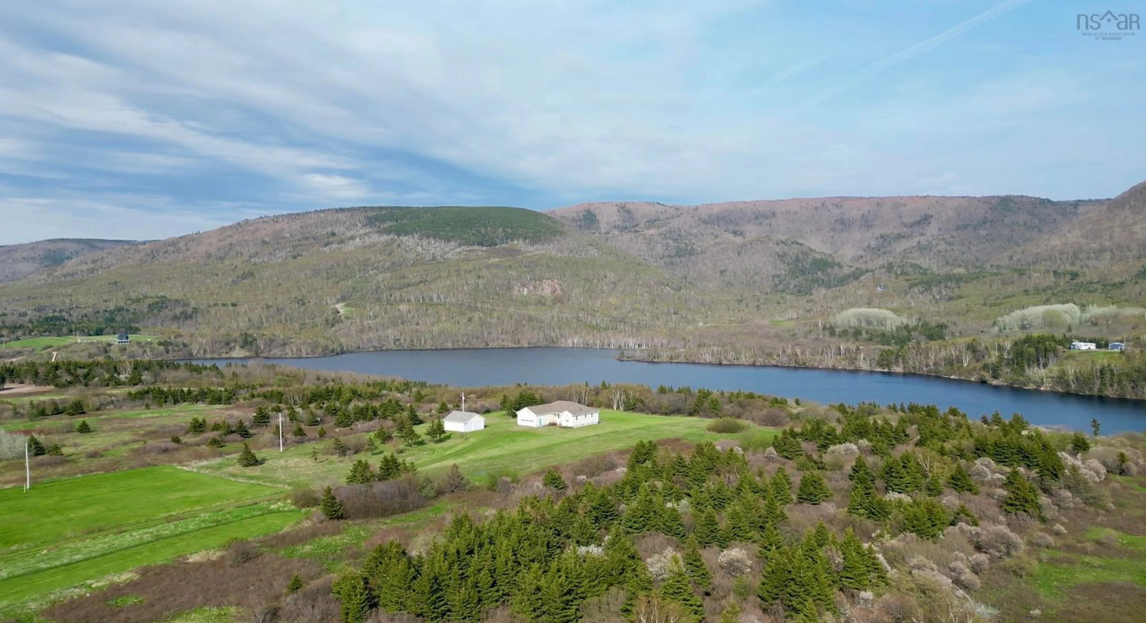 A pic from outside/outdoor area/front of a property/back of a property/a pic from drone, water/lake/river/ocean view for 13540 Cabot Trail Road, Grand Étang Nova Scotia B0E 1L0
