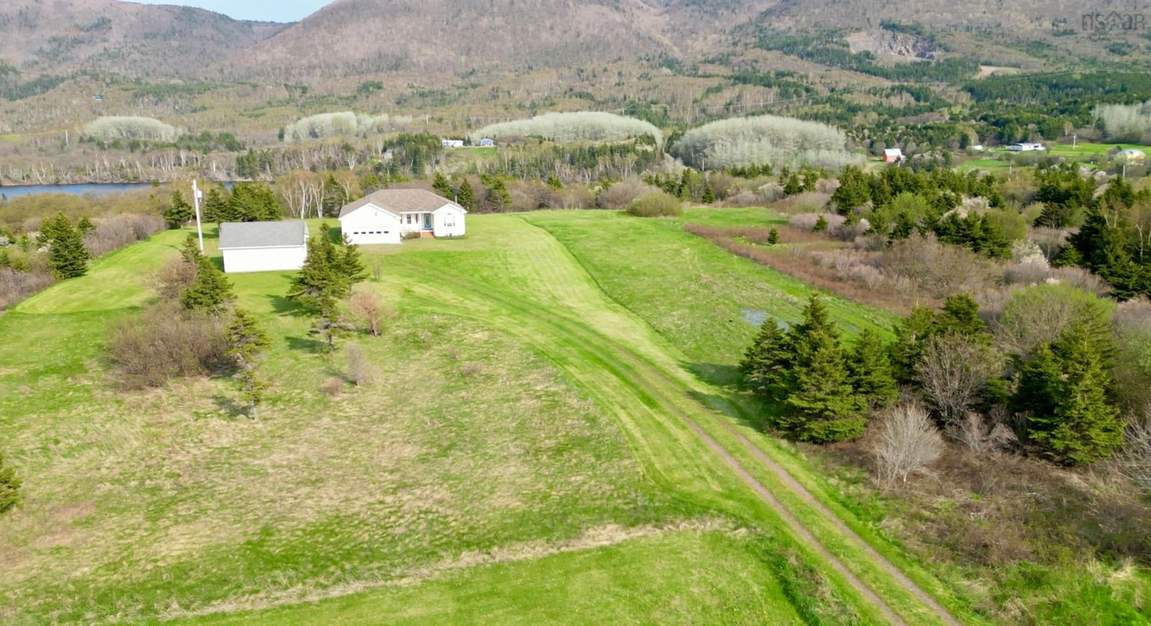 A pic from outside/outdoor area/front of a property/back of a property/a pic from drone, mountain view for 13540 Cabot Trail Road, Grand Étang Nova Scotia B0E 1L0