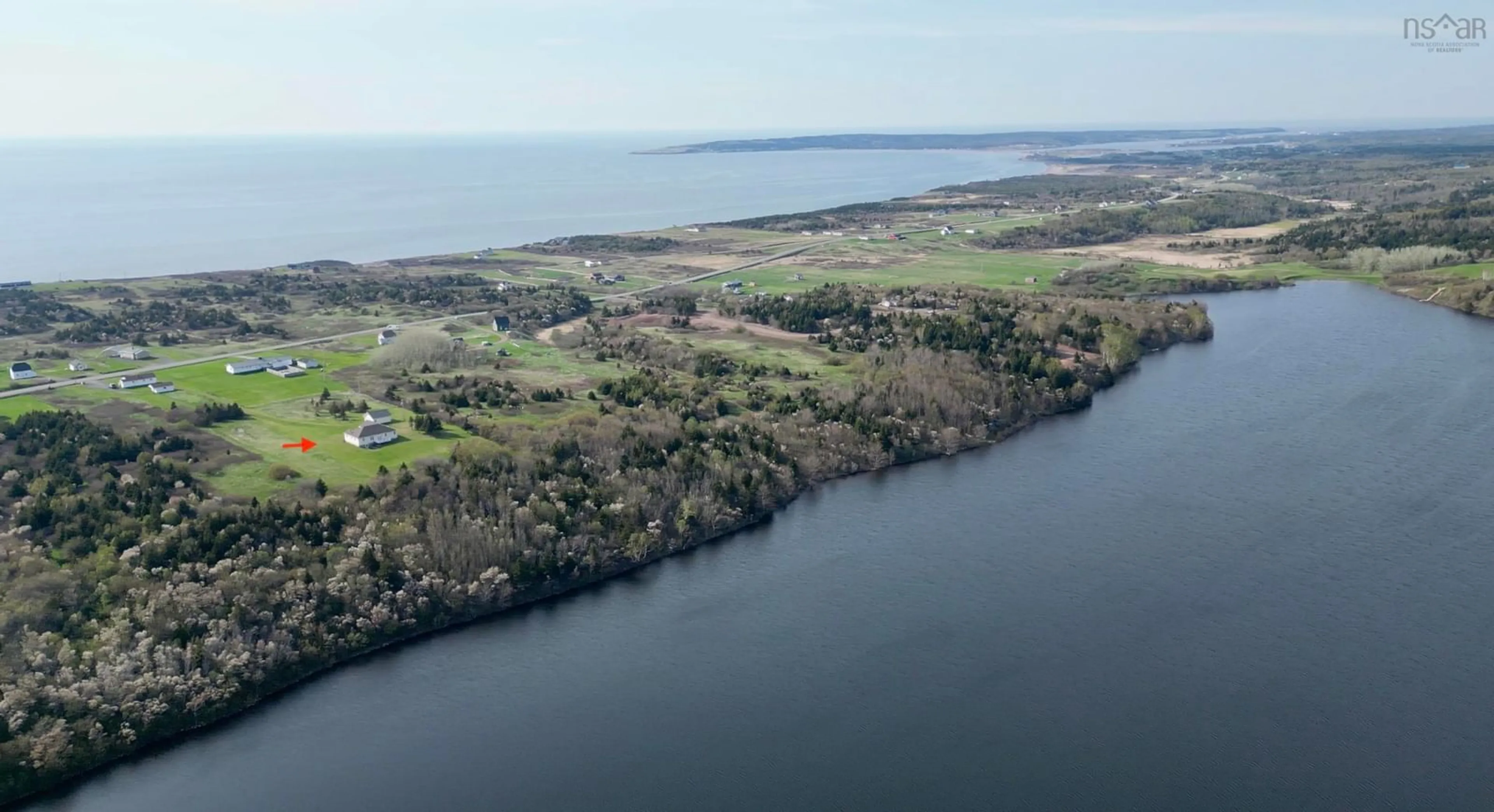 A pic from outside/outdoor area/front of a property/back of a property/a pic from drone, water/lake/river/ocean view for 13540 Cabot Trail Road, Grand Étang Nova Scotia B0E 1L0