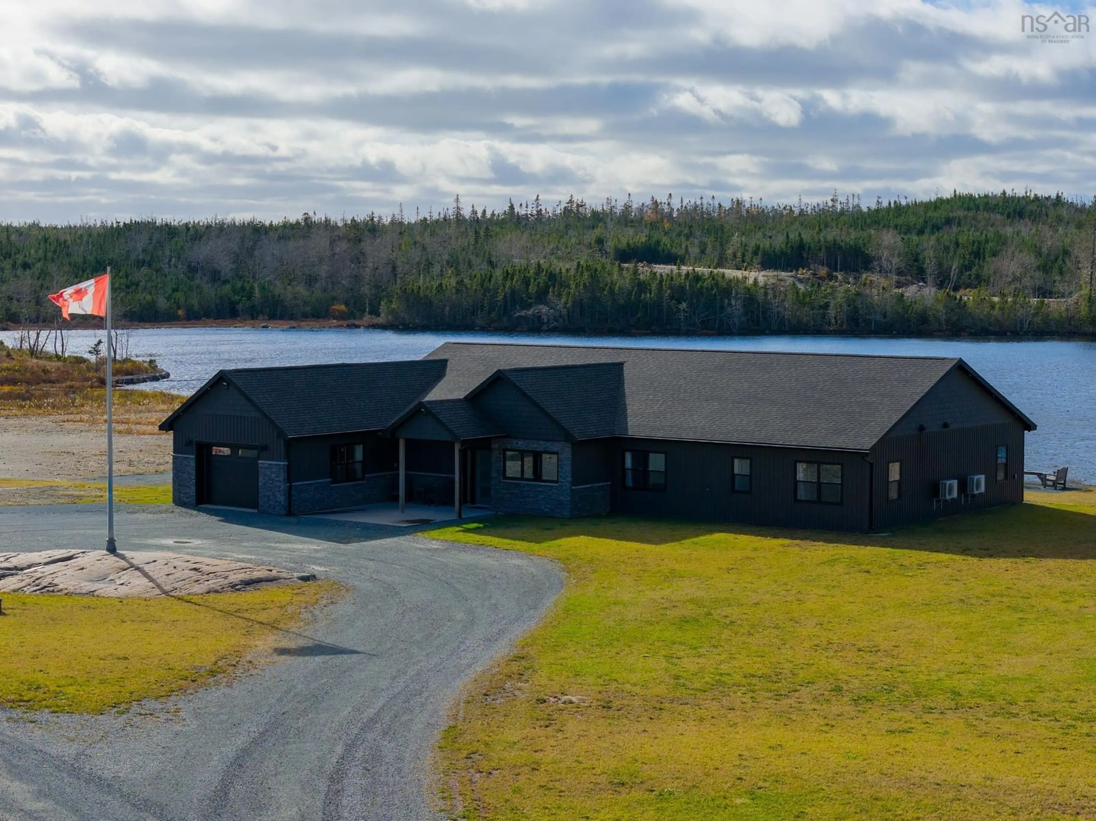 A pic from outside/outdoor area/front of a property/back of a property/a pic from drone, water/lake/river/ocean view for 5121 Clam Harbour Rd, Lake Charlotte Nova Scotia B0J 2L0