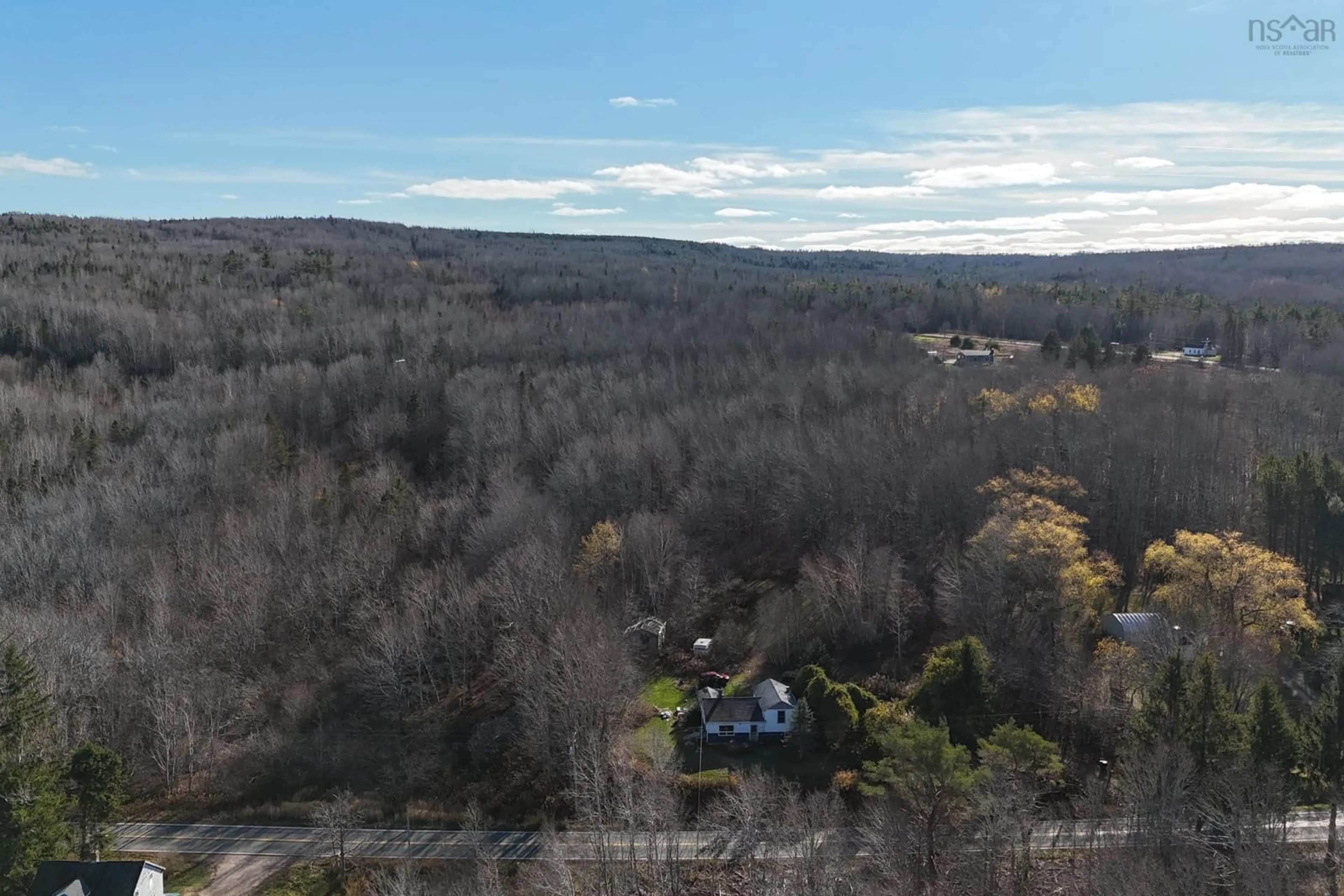 A pic from outside/outdoor area/front of a property/back of a property/a pic from drone, forest/trees view for 7006 Highway 201, South Williamston Nova Scotia B0P 1M0