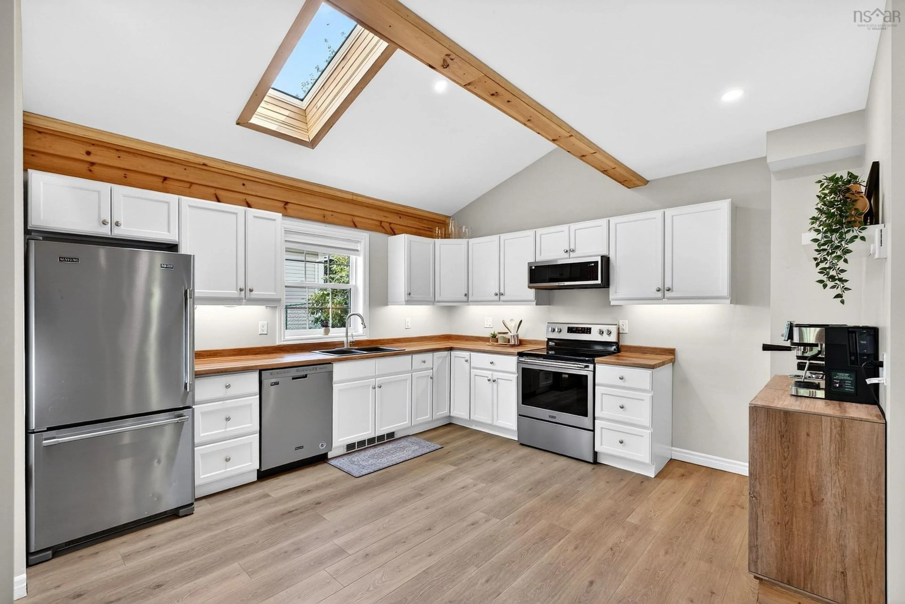 Open concept kitchen, wood/laminate floor for 2989 Connaught Ave, Halifax Nova Scotia B3L 3A5