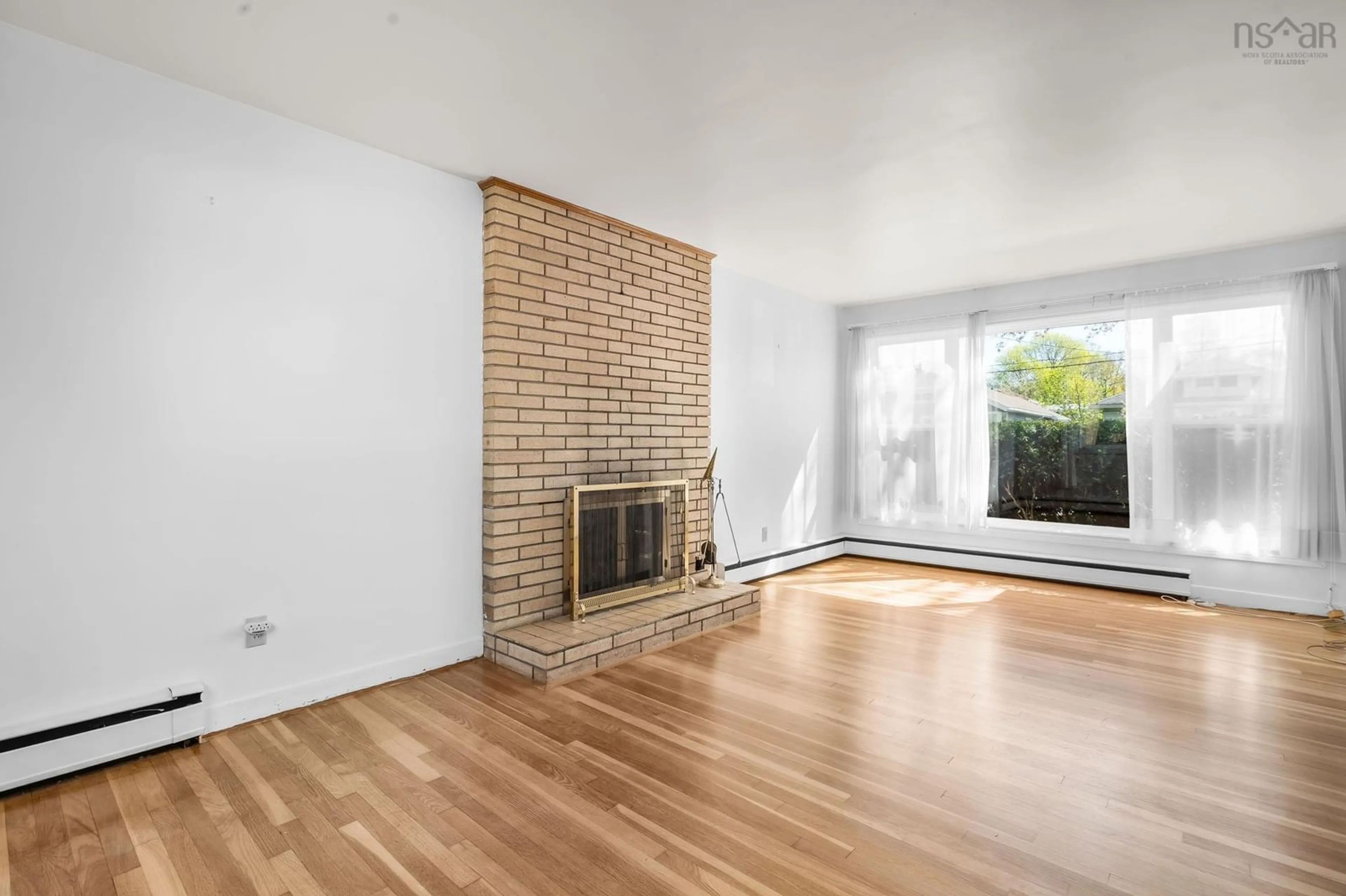Living room with furniture, wood/laminate floor for 876 Bridges St, Halifax Nova Scotia B3H 2Z7